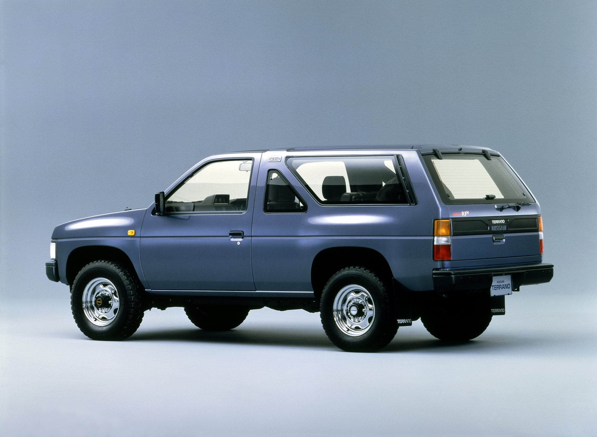 Official Nissan press photo of the 1986 Terrano R3M two-door, rear three-quarter showing window layout