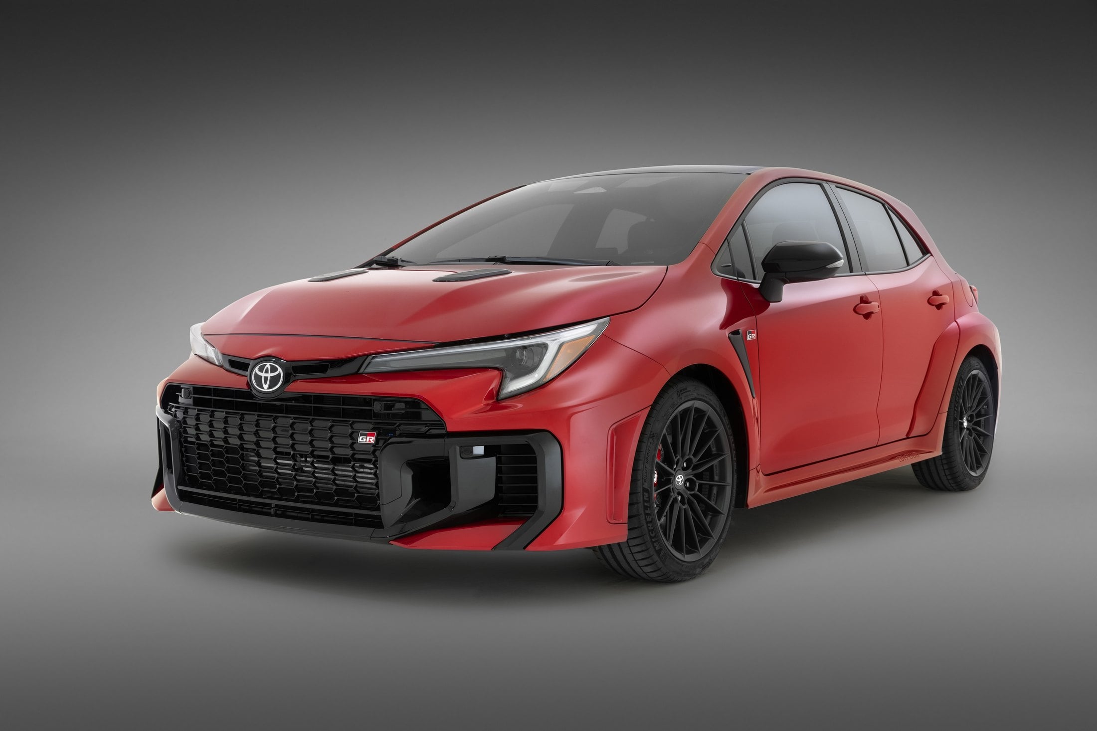 2026 Toyota GR Corolla Supersonic Red studio front three-quarter