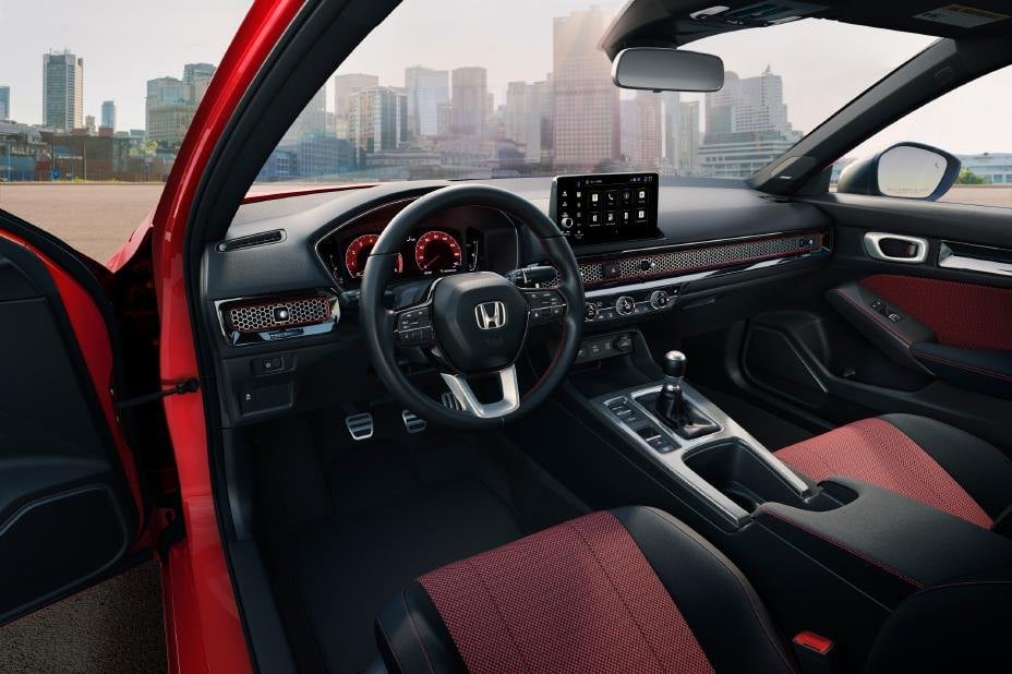 Official Honda photo of the Civic Si cabin with a six-speed manual shifter and three pedals