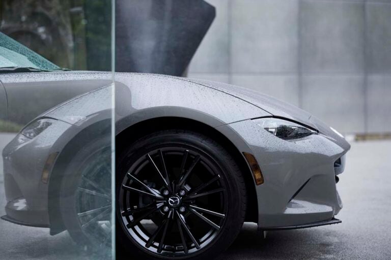 Official Mazda photo of a 2026 MX-5 Miata front wheel and LED headlight in Aero Gray Metallic