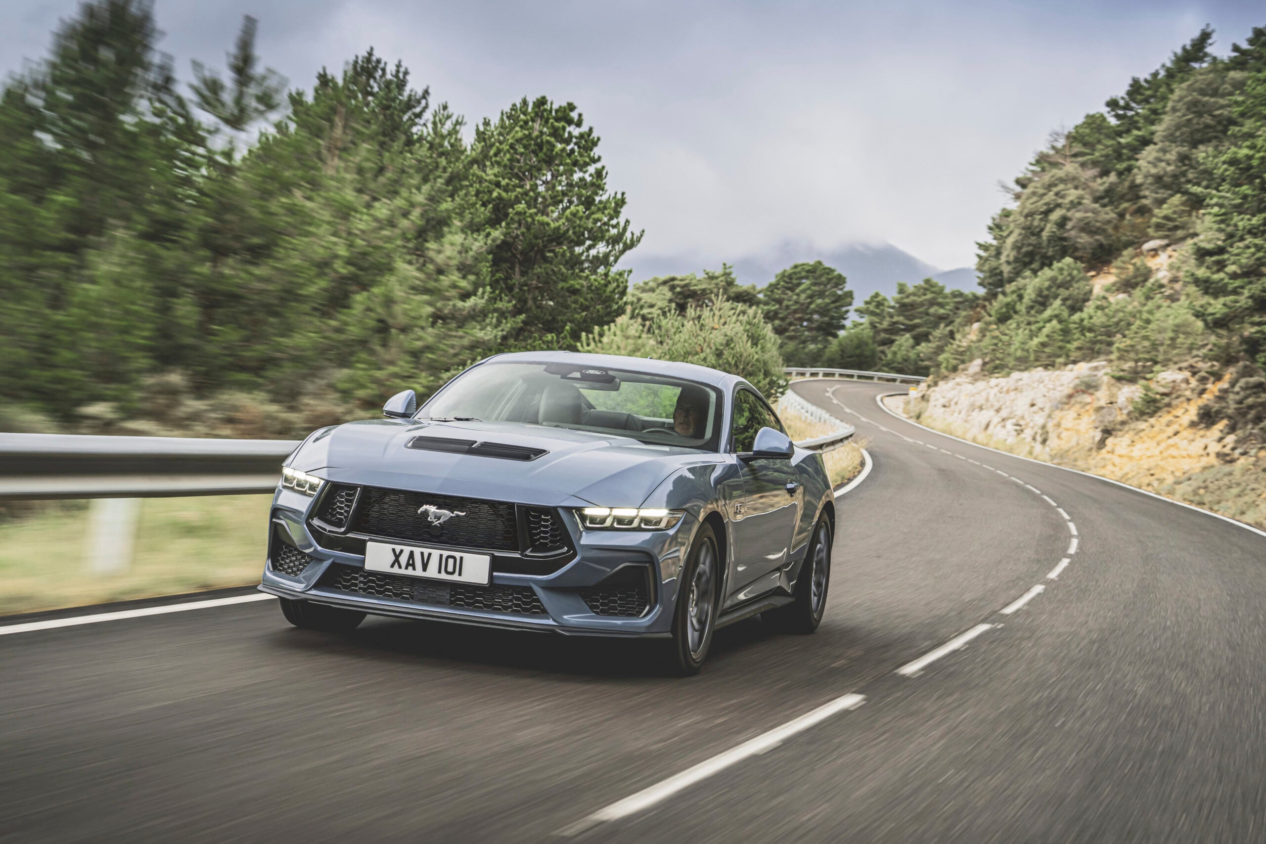 Official Ford photo of Mustang GT front three-quarter driving a mountain road