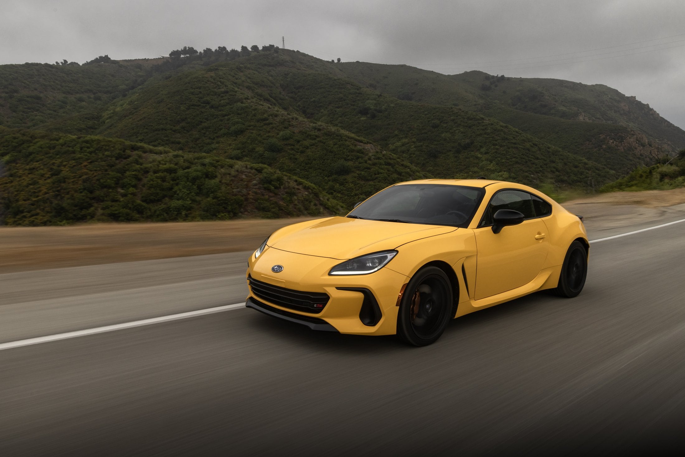 2026 Subaru BRZ Series.Yellow driving on a mountain road