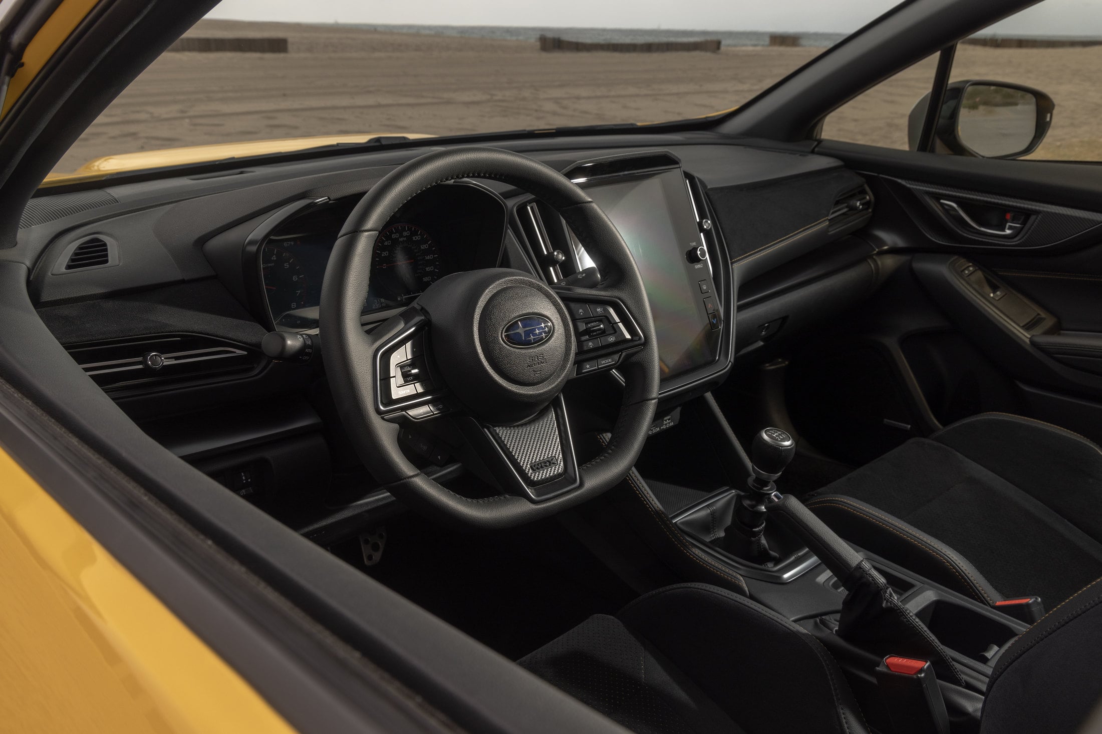 2026 Subaru WRX Series.Yellow cockpit with six-speed manual shifter