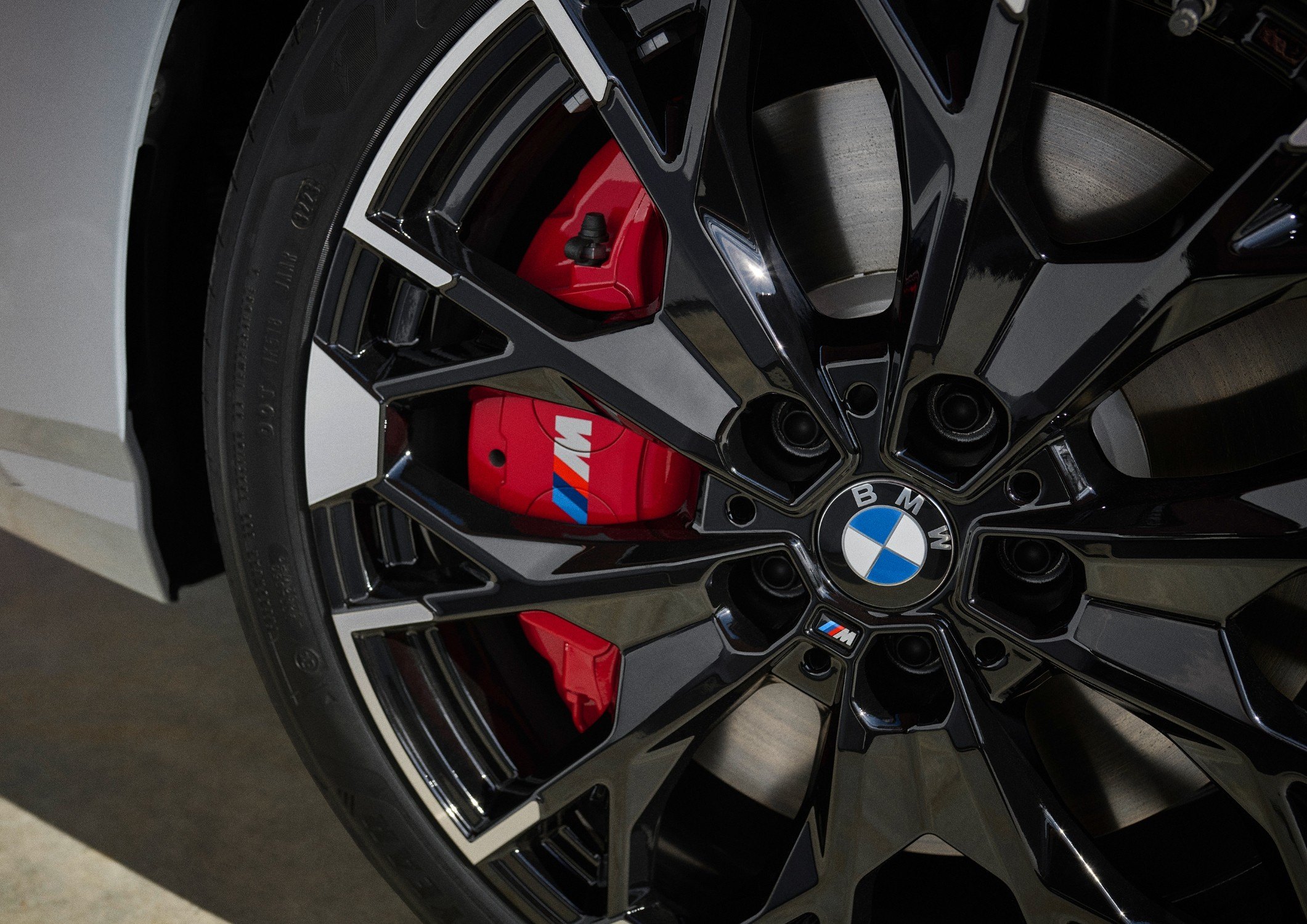 Official BMW press photo of an M235 xDrive Gran Coupe wheel with red M Sport brake calipers