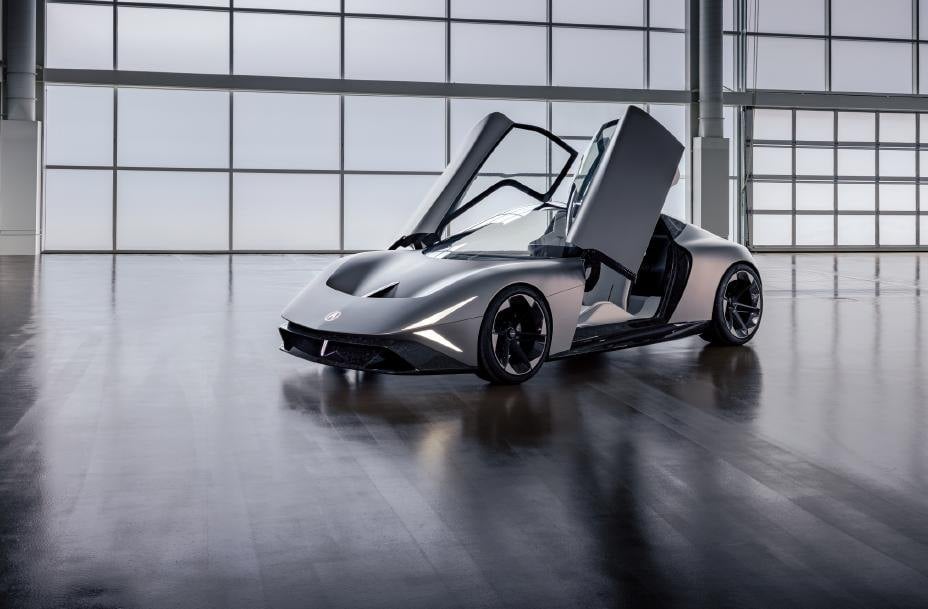 Official photo of the Acura NEXERA Vision concept with dual-hinge butterfly doors open in a studio