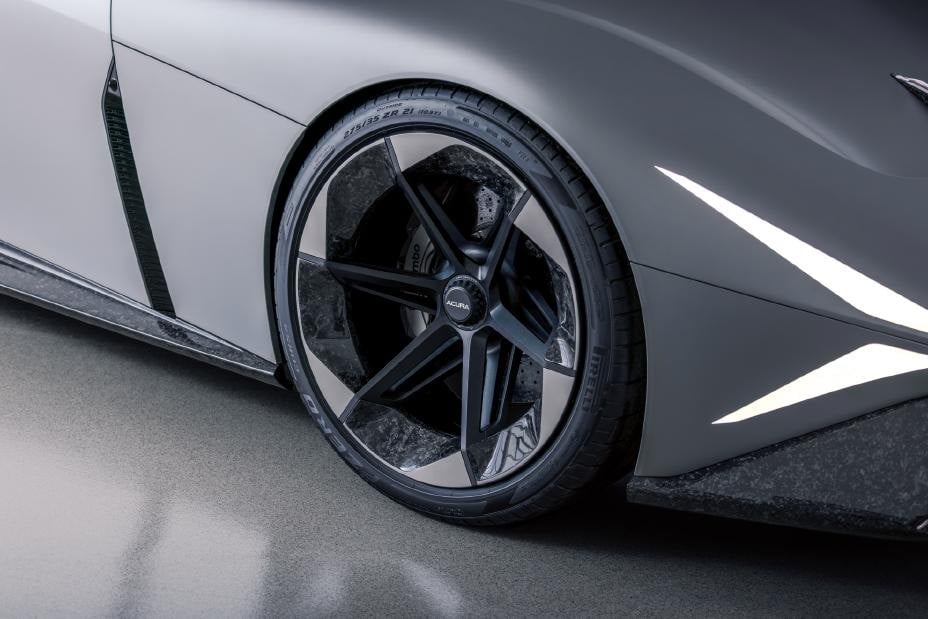 Official photo of the Acura NEXERA Vision concept front wheel with forged-carbon inserts and phantom lighting
