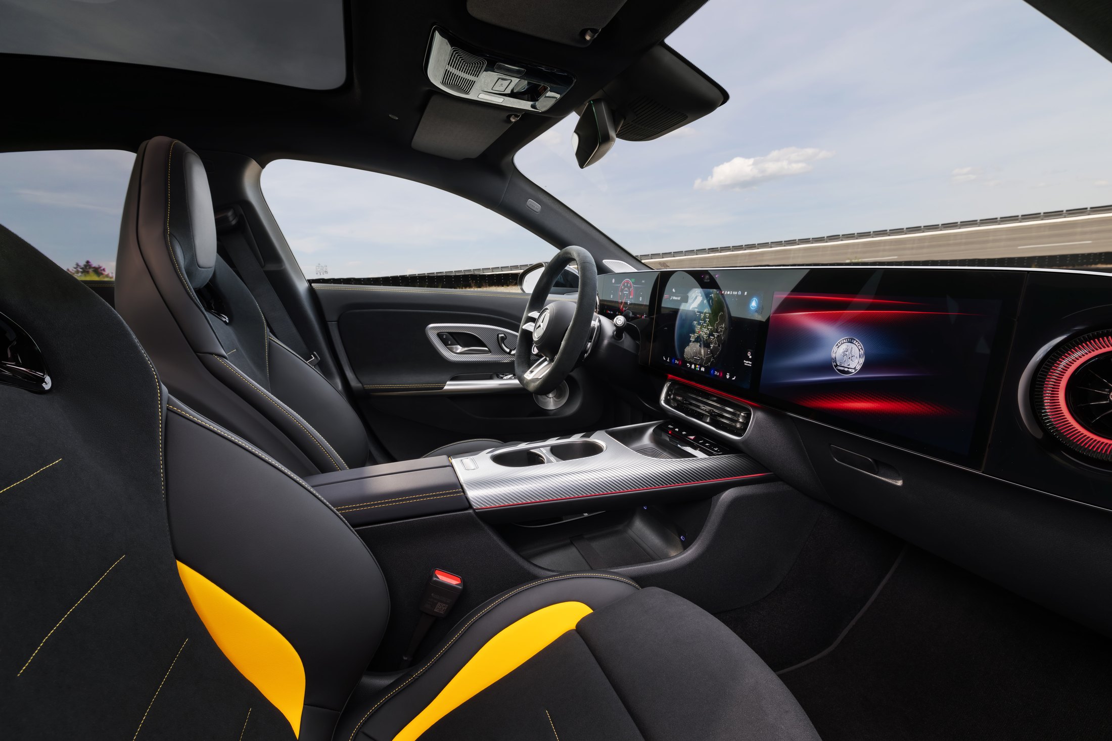 Official Mercedes-AMG photo of the CLA 45 cabin with Performance seats, yellow stitching, and the MBUX Superscreen