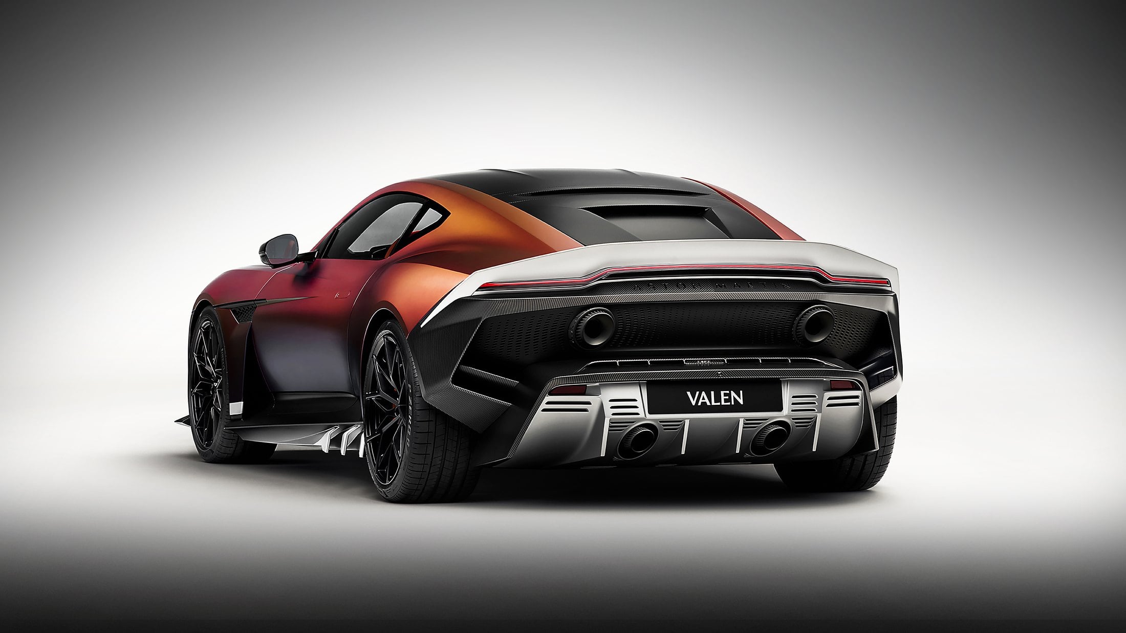 Official photo of the Aston Martin Valen rear three-quarter in Satin Andromeda Red