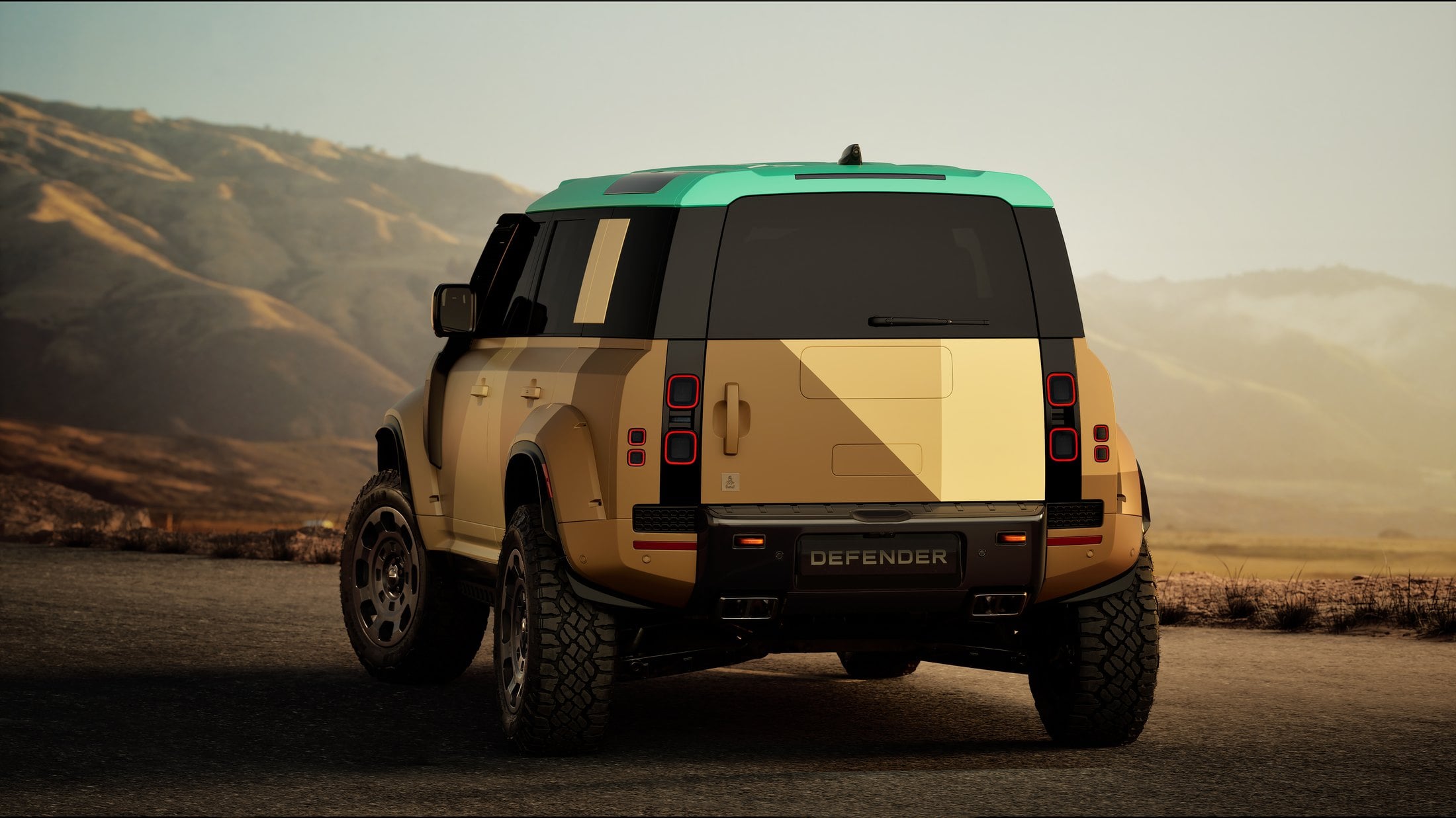 Official photo of the Defender Dakar, rear three-quarter in Dakar Sand with a Yanbu Turquoise roof