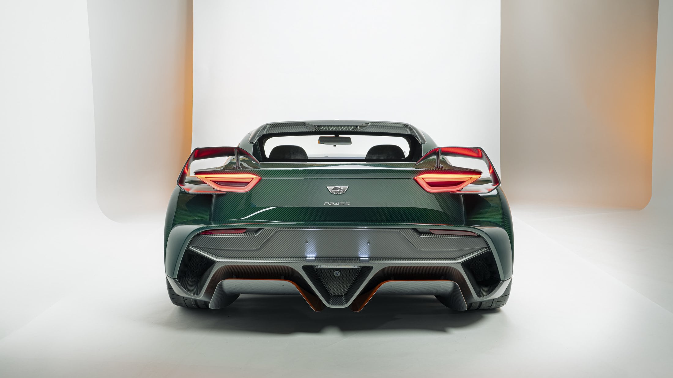 Official Donkervoort studio photo of the P24 RS, straight-on rear with P24 RS badge and carbon diffuser