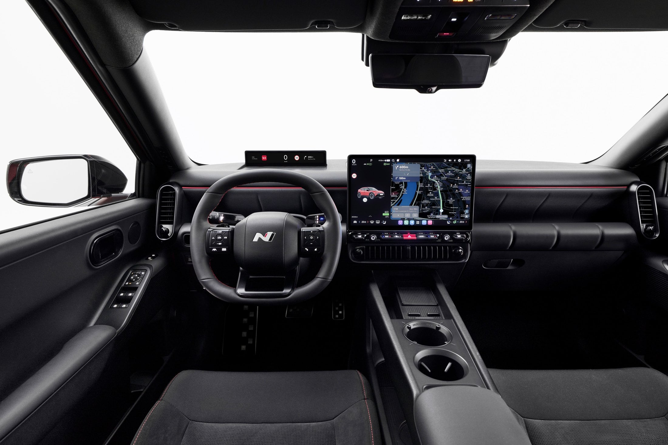 Official photo of the Hyundai IONIQ 3 N Line cabin, N steering wheel and Pleos Connect screen