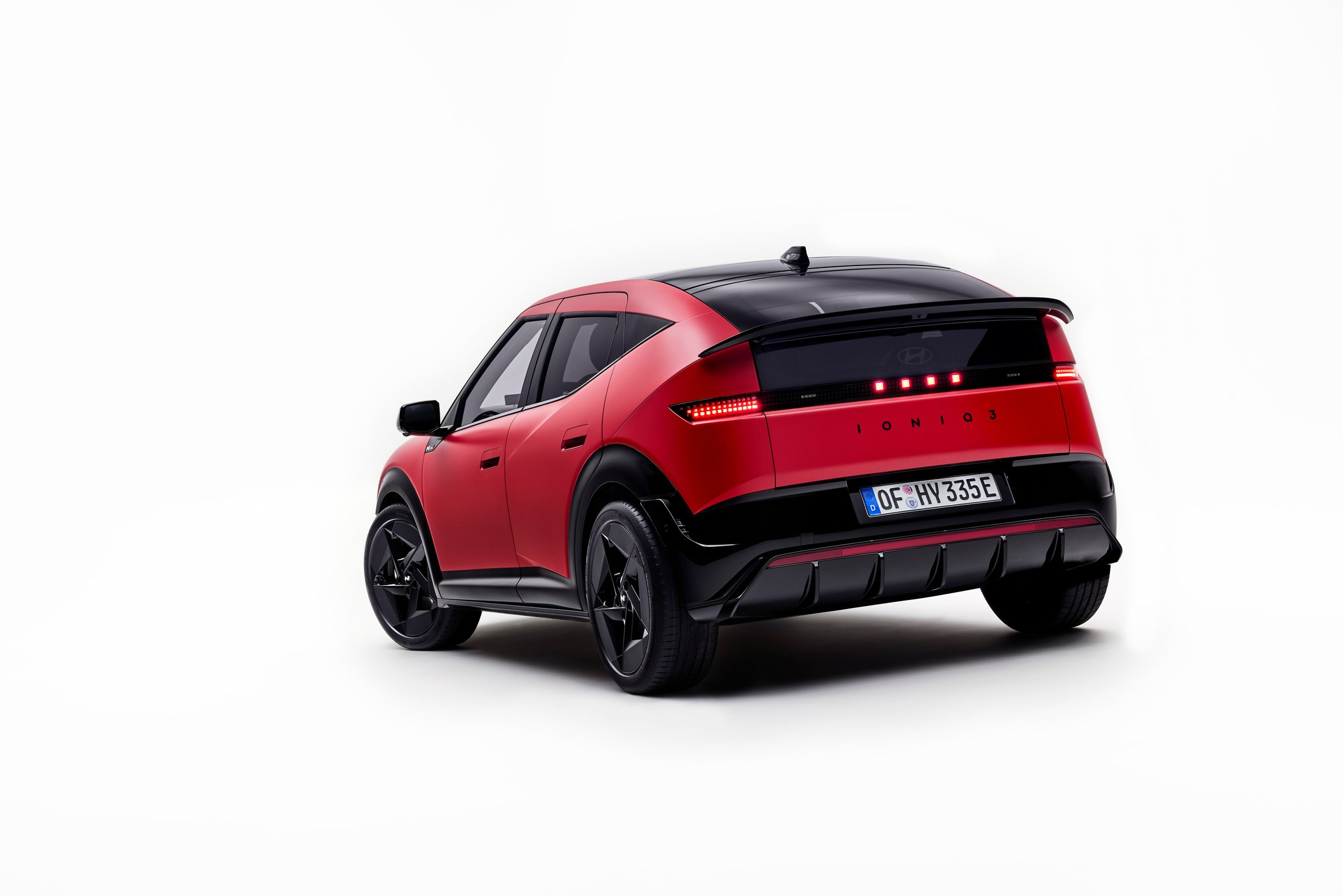 Official photo of the red Hyundai IONIQ 3 N Line, rear three-quarter with pixel taillights