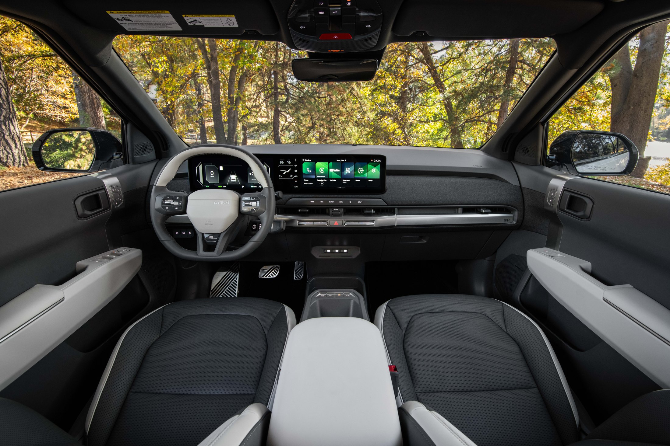 Official Kia photo of the 2027 EV3 cabin with dual 12.3-inch displays and a 5-inch climate strip