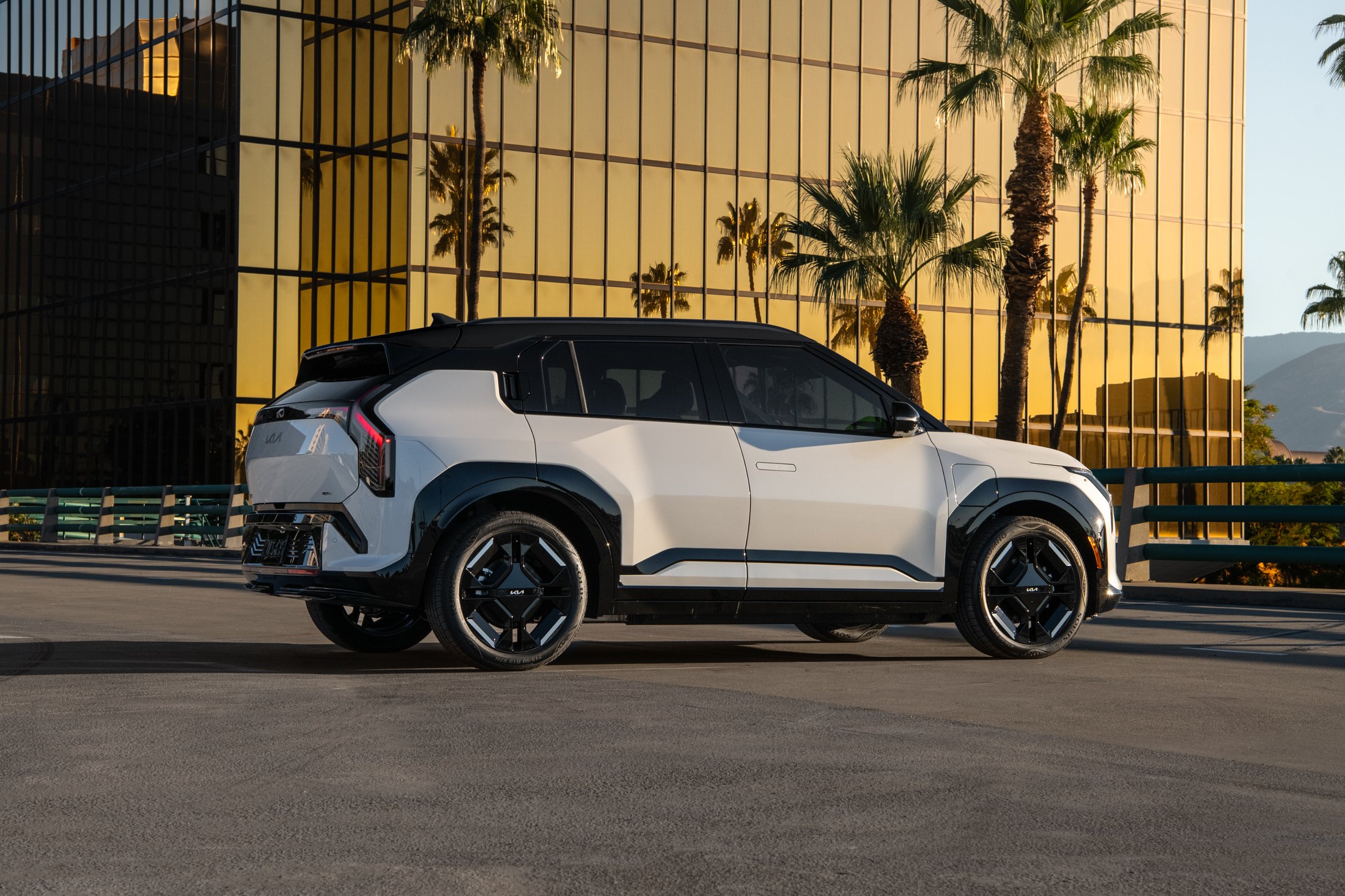 Official Kia photo of the 2027 EV3, rear three-quarter showing Star Map taillights