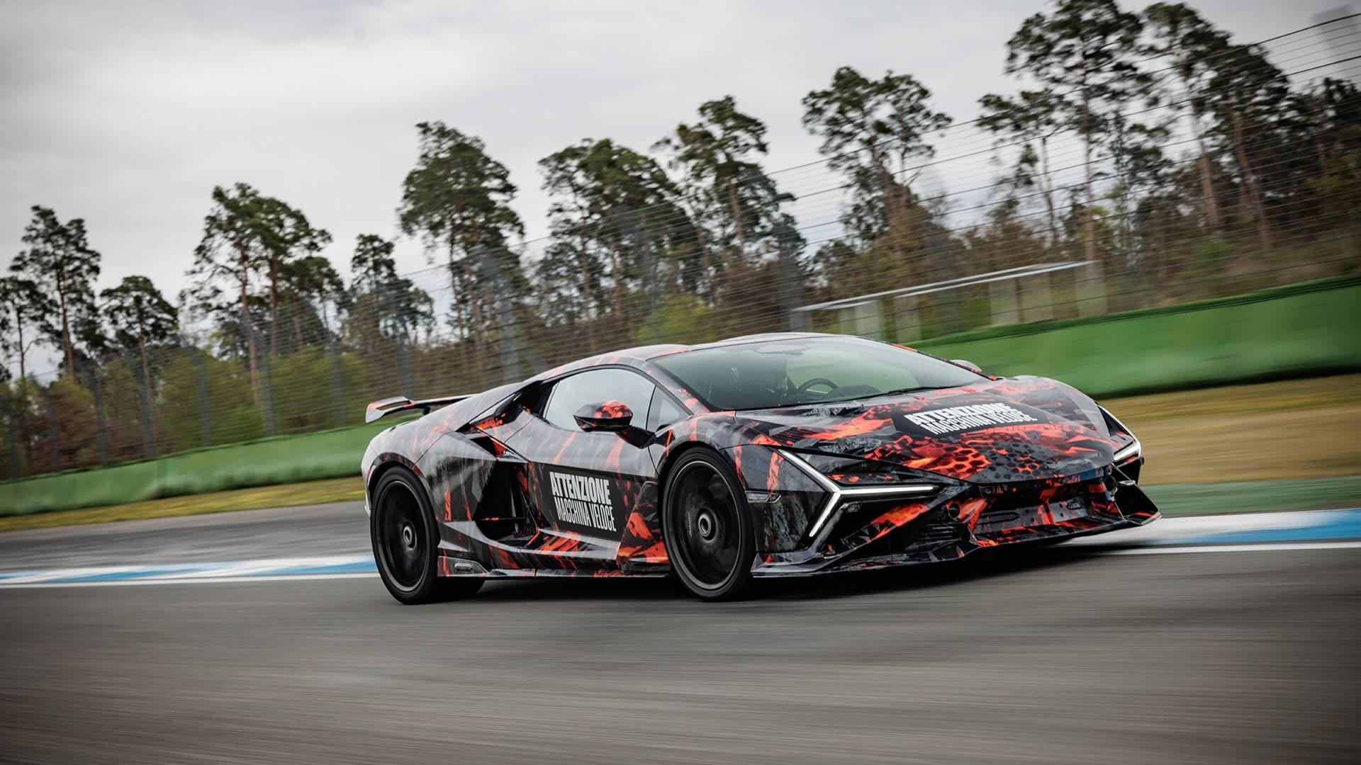 Official photo of the camouflaged Lamborghini Revuelto SV on track at the Hockenheimring