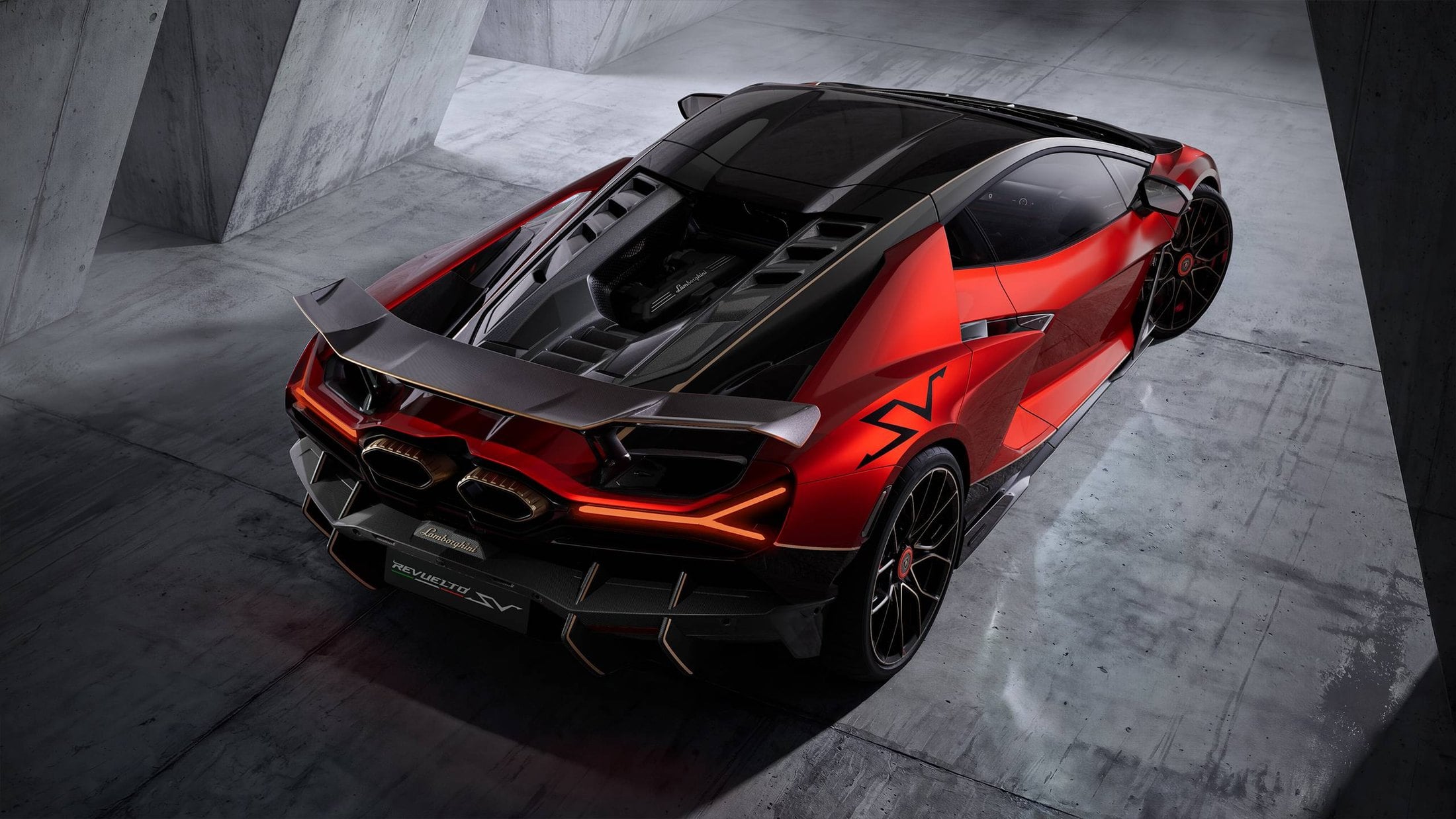 Official photo of the Lamborghini Revuelto SV rear three-quarter, fixed wing and hexagonal exhausts