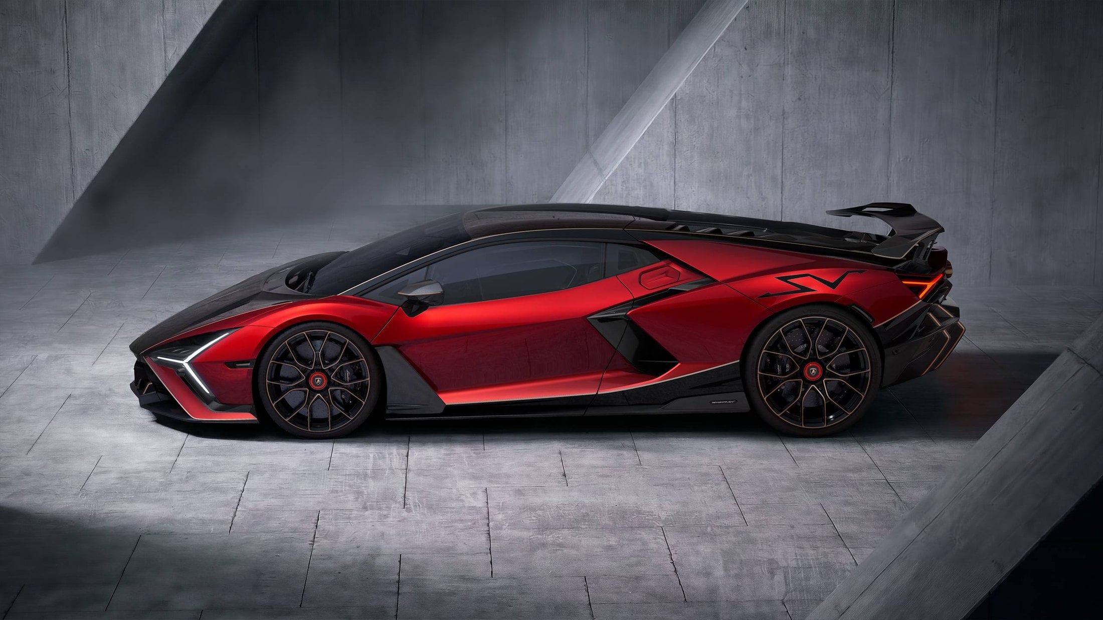 Official photo of the Lamborghini Revuelto SV side profile in red and black