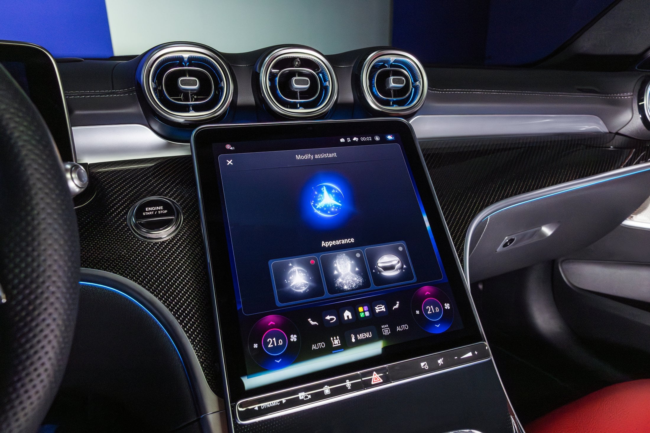 Official photo of the Mercedes-Benz C-Class interior showing the portrait MBUX screen and Virtual Assistant avatars