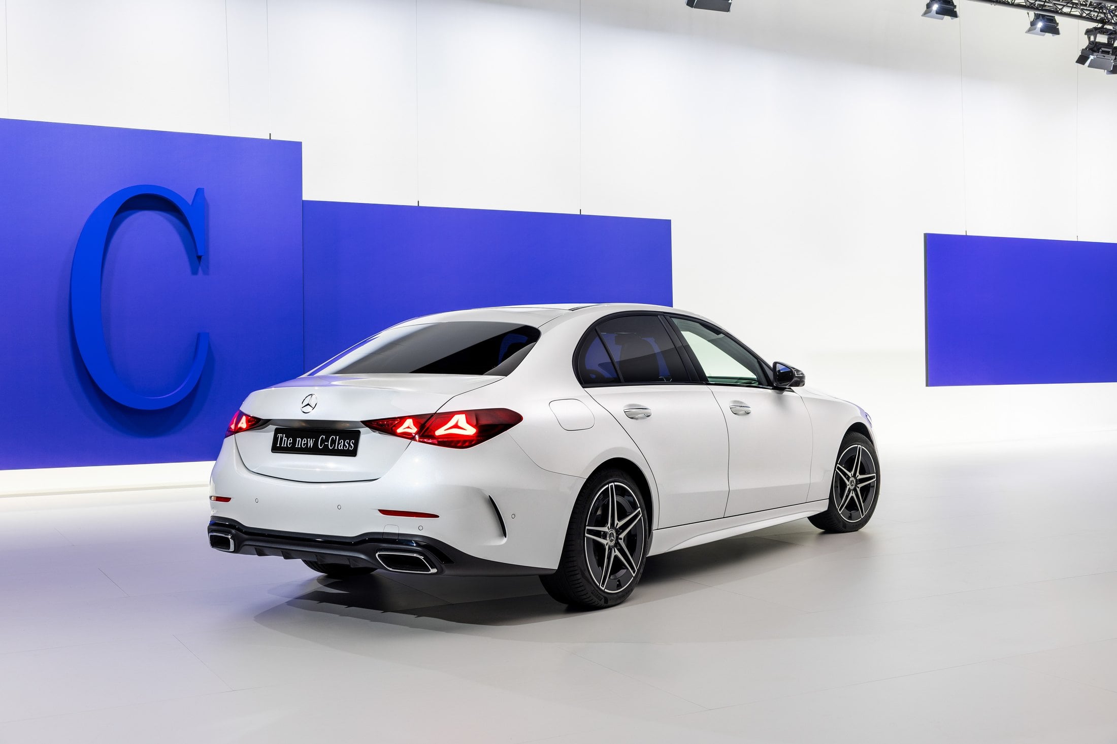 Official photo of the white Mercedes-Benz C-Class Saloon, rear three-quarter, showing the new tail lamps