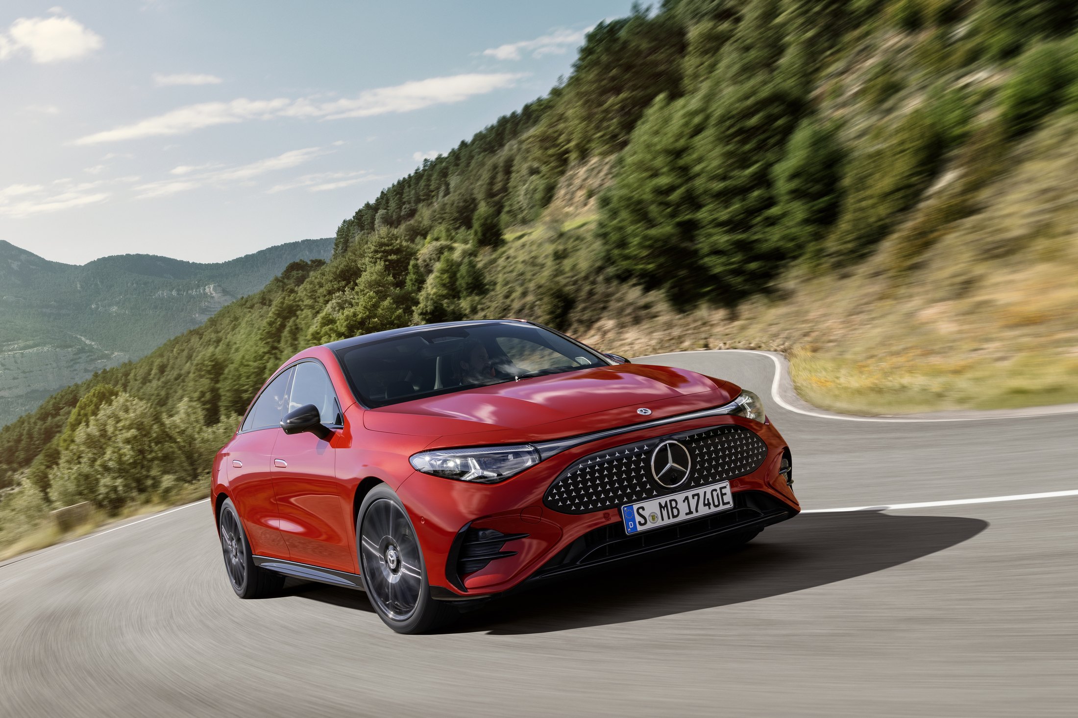 Official Mercedes-Benz photo of the CLA 250+ with EQ Technology, front three-quarter in MANUFAKTUR Patagonia Red Metallic