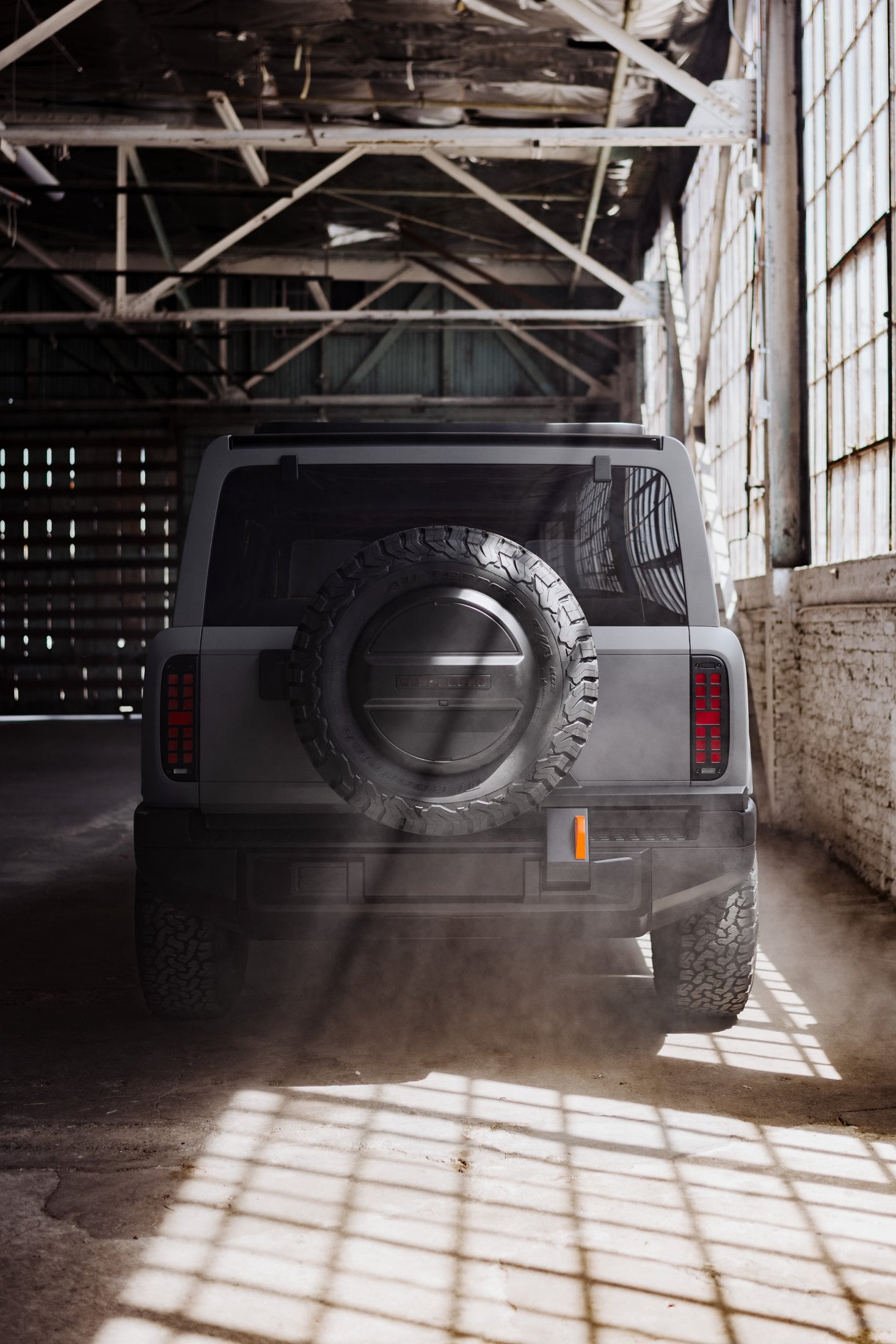 Official rear view of the Slate SUV with a full-size spare and vertical LED taillights