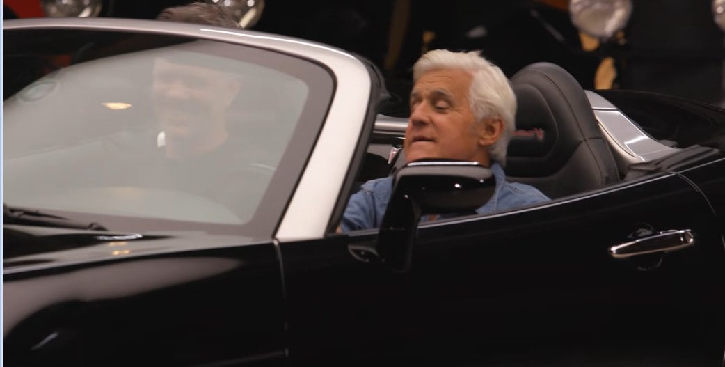 Jay Leno in the passenger seat of Franz von Holzhausen's Solstice
