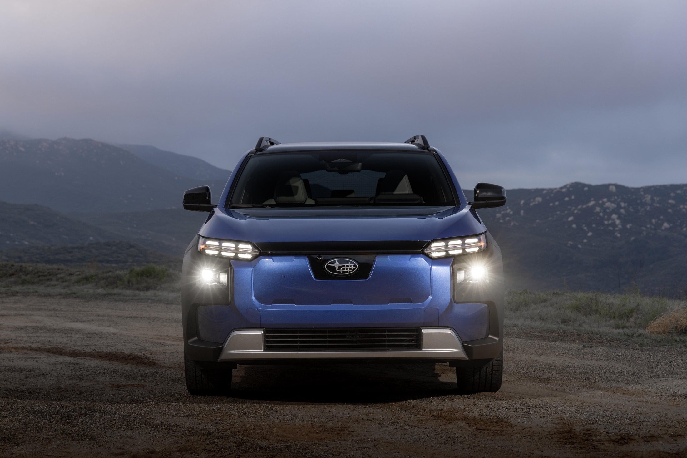 Official Subaru photo of the 2027 Trailseeker, head-on EV face and six-star logo