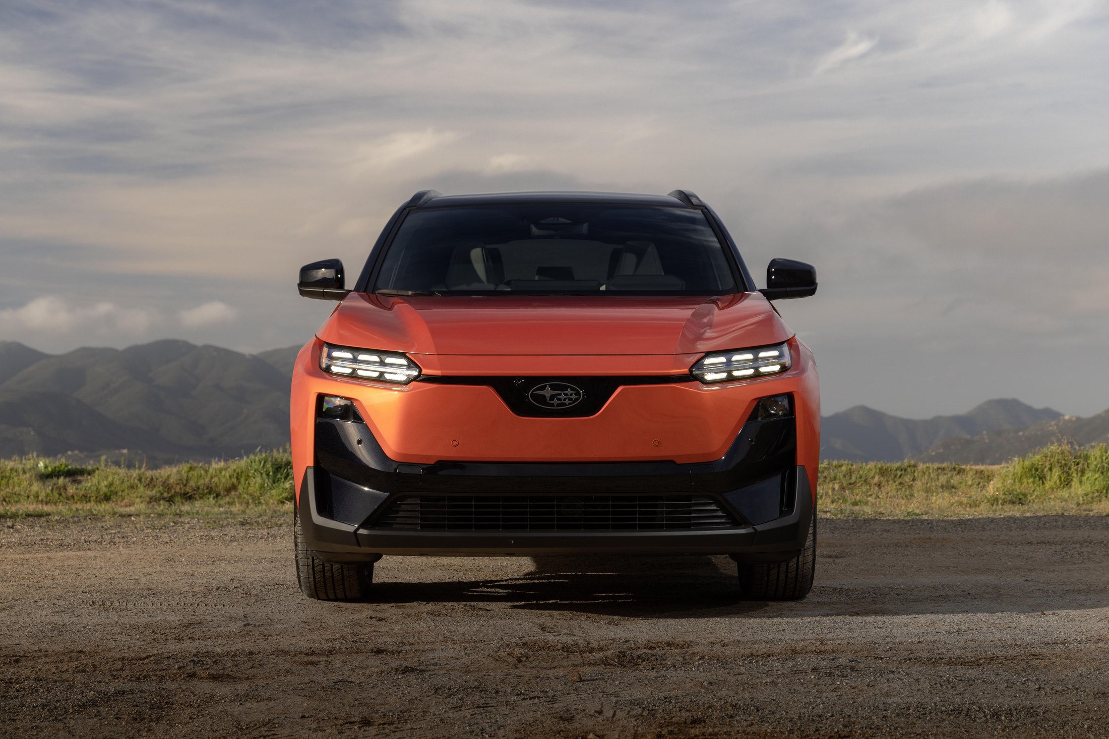 Official Subaru photo of the 2027 Uncharted, head-on EV face and six-star logo