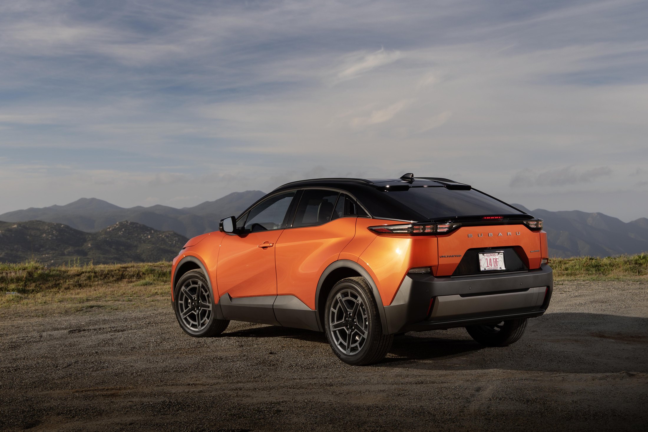 Official Subaru photo of the 2027 Uncharted, rear three-quarter in Habanero Orange