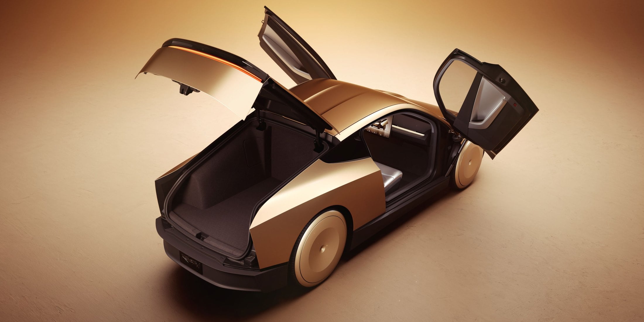 Overhead rear three-quarter of the gold Tesla Cybercab with trunk and falcon-wing door open