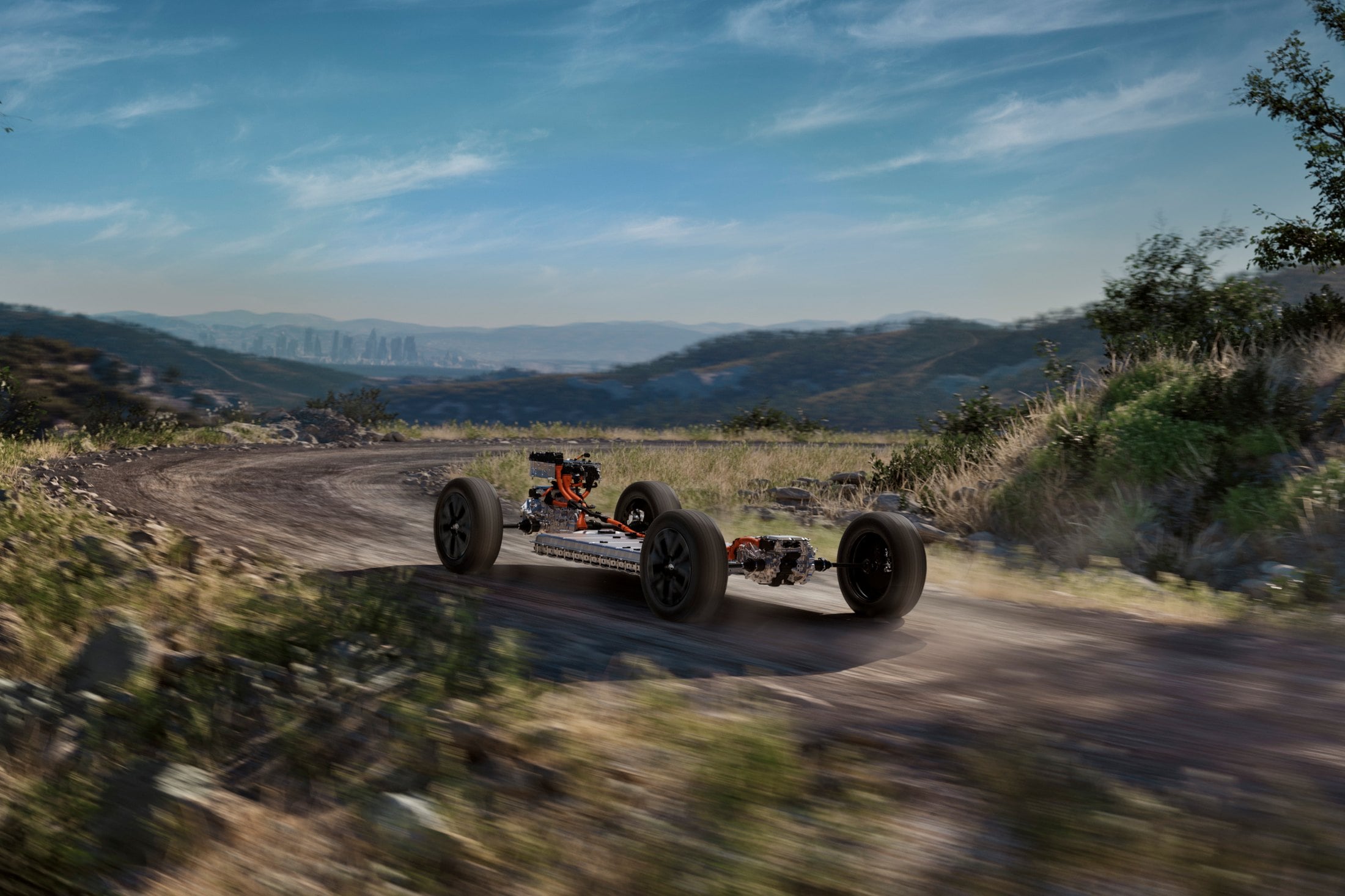 Official Toyota photo of the 2027 bZ Woodland skateboard chassis with dual motors on a dirt road