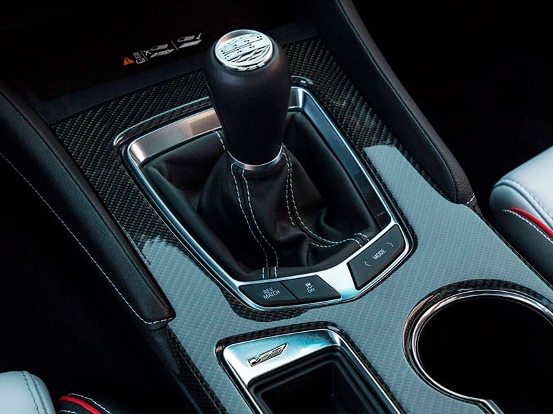 Official Cadillac photo of the CT4-V Blackwing six-speed manual shifter with REV MATCH button and carbon console