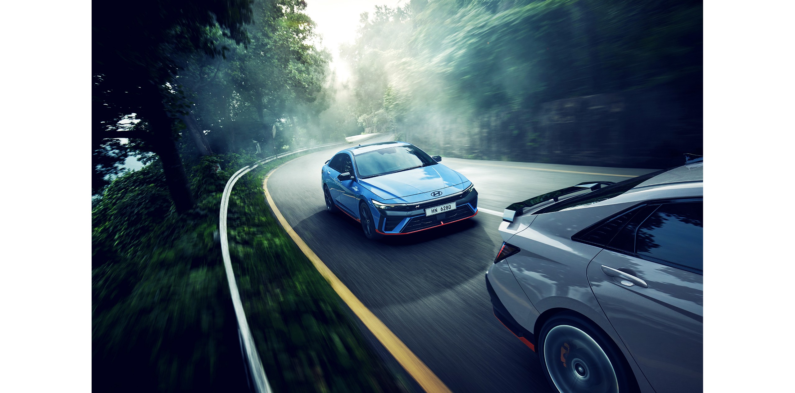 Official Hyundai photo of Elantra N cars on a mountain road
