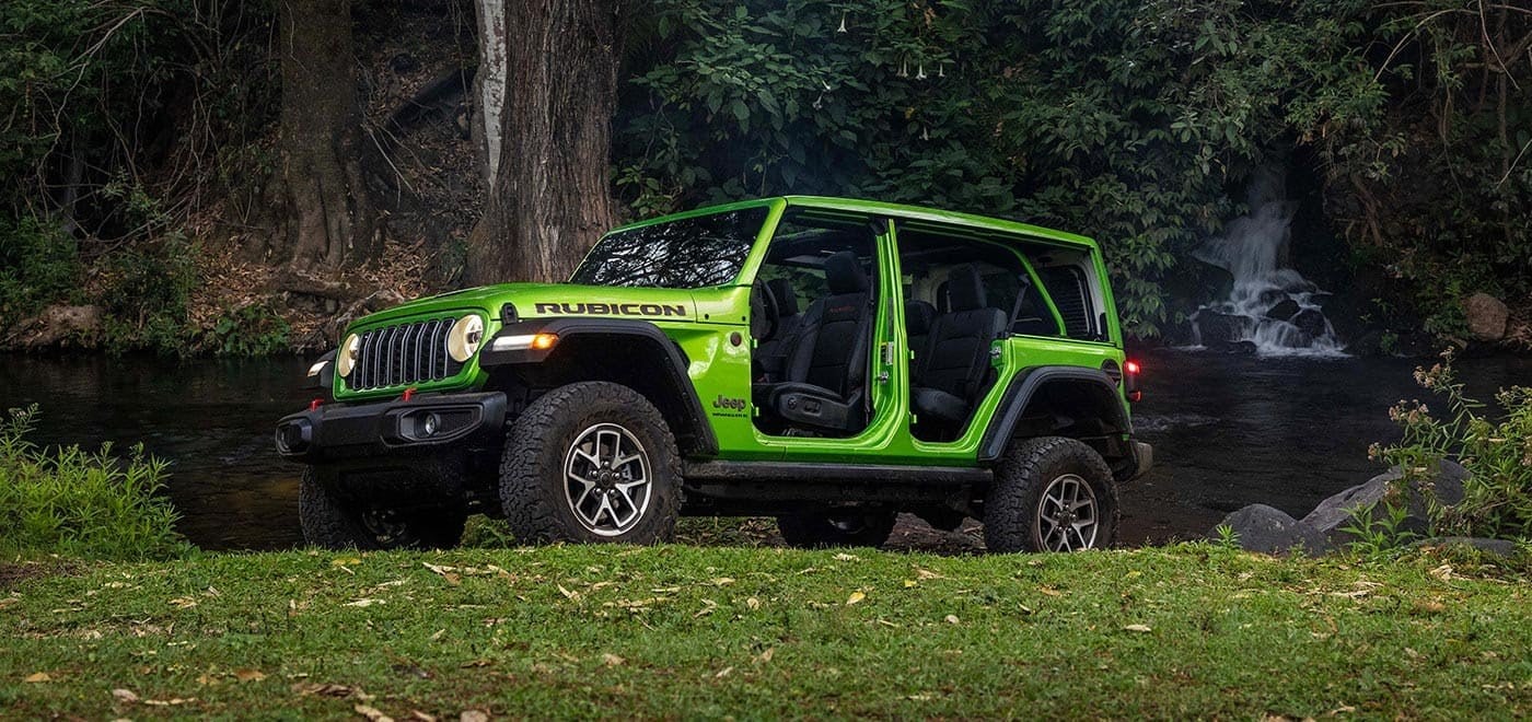 Official Jeep photo of a 2026 Wrangler on trail terrain