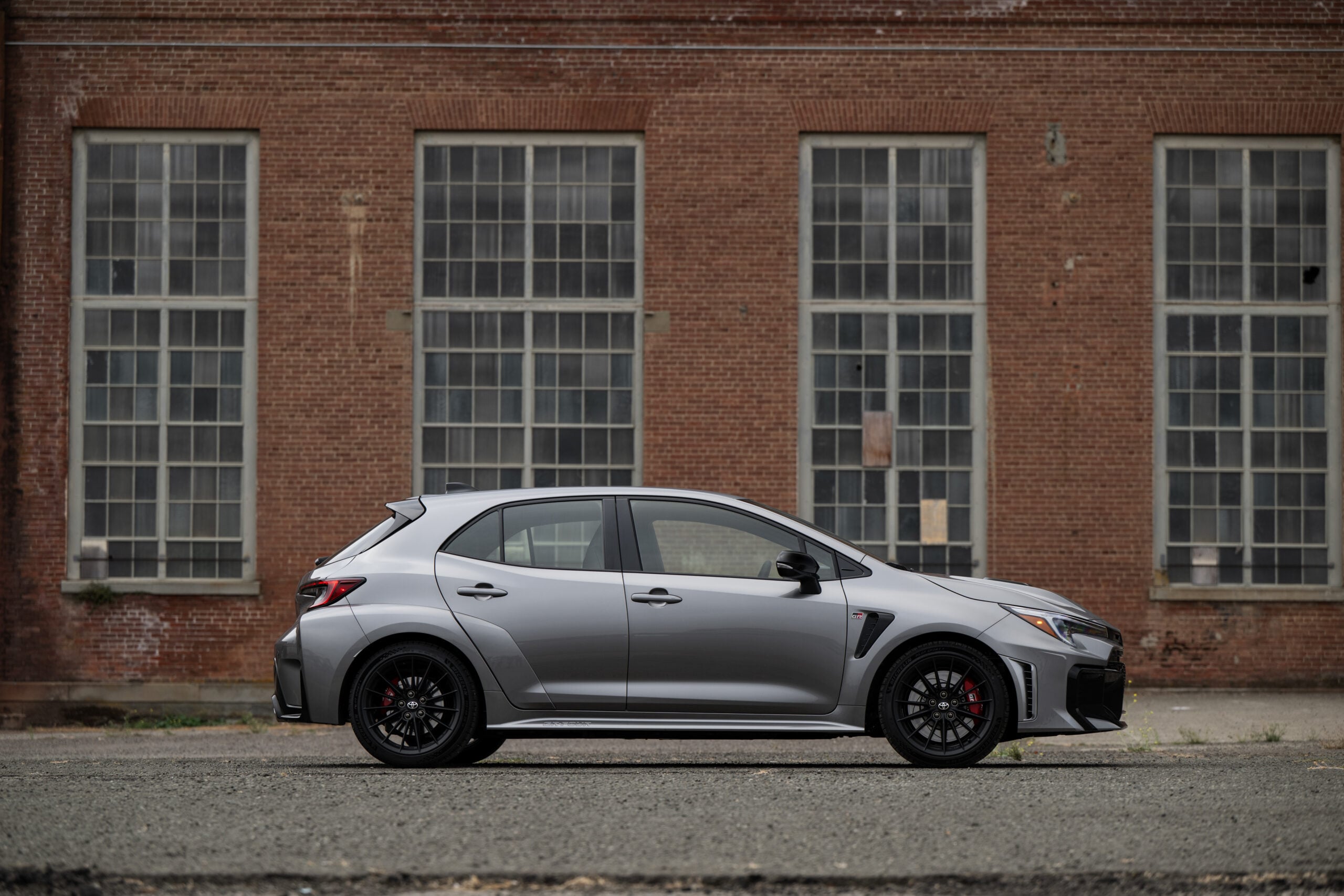Official Toyota photo of 2026 GR Corolla Premium Plus Heavy Metal rear three-quarter