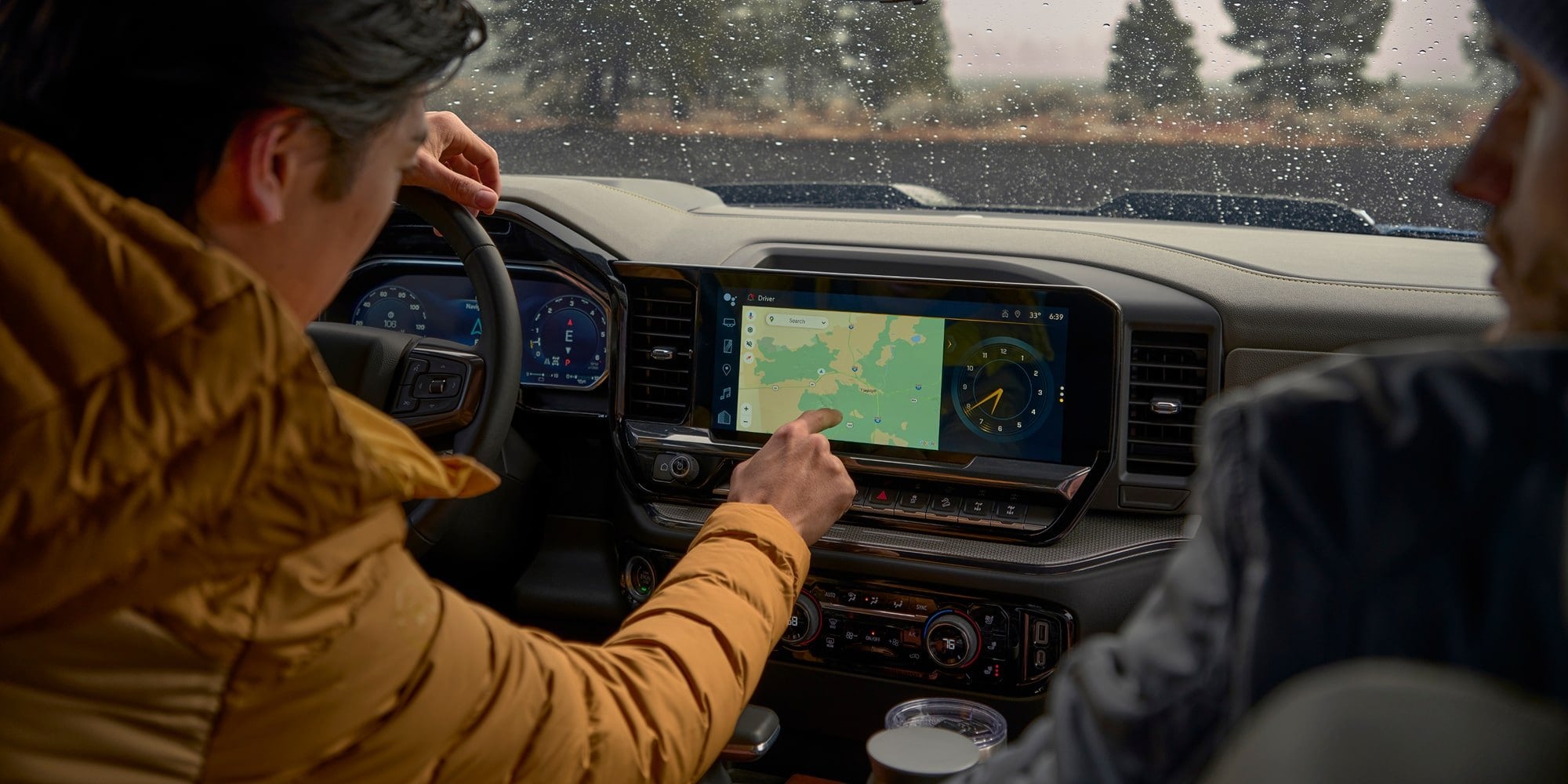 Official Chevrolet photo of a 2026 Silverado 1500 cabin with the wide center touchscreen showing navigation