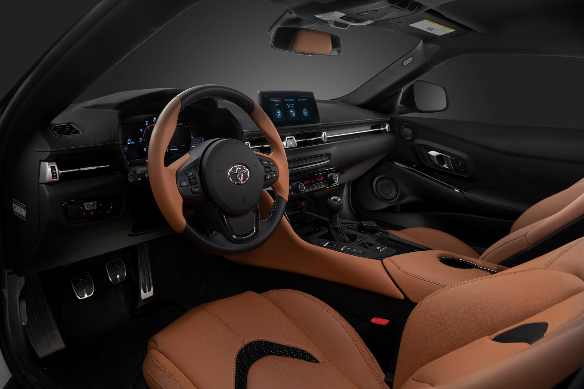 Official Toyota photo of a 2026 GR Supra with six-speed manual side profile