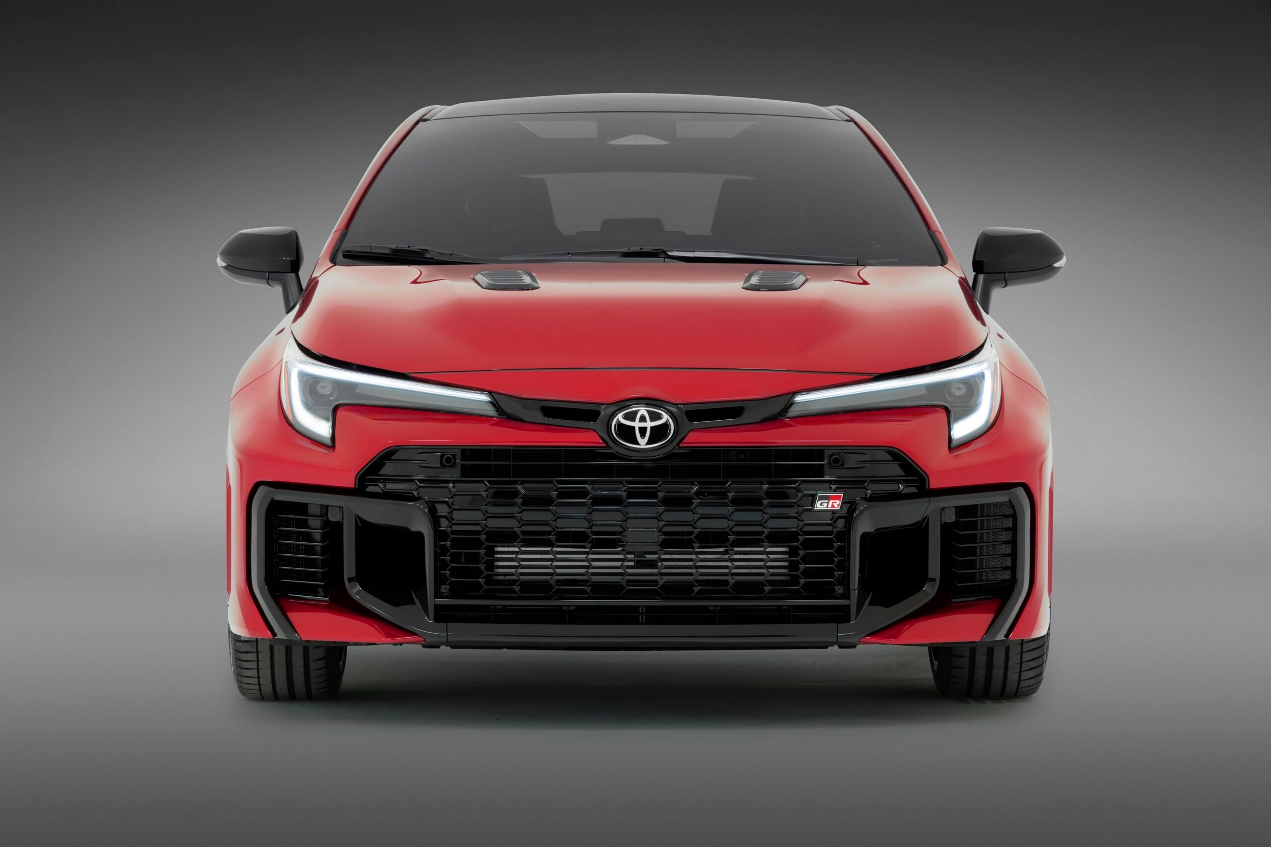 Official Toyota photo of 2026 GR Corolla Supersonic Red exterior three-quarter