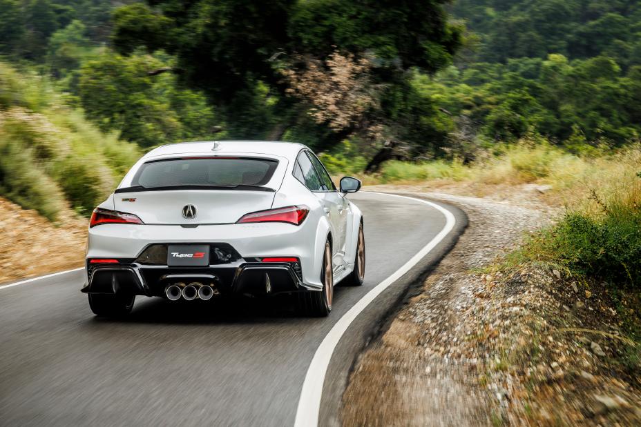 Official Acura photo of a Platinum White Pearl 2026 Integra Type S rear three-quarter on a canyon road