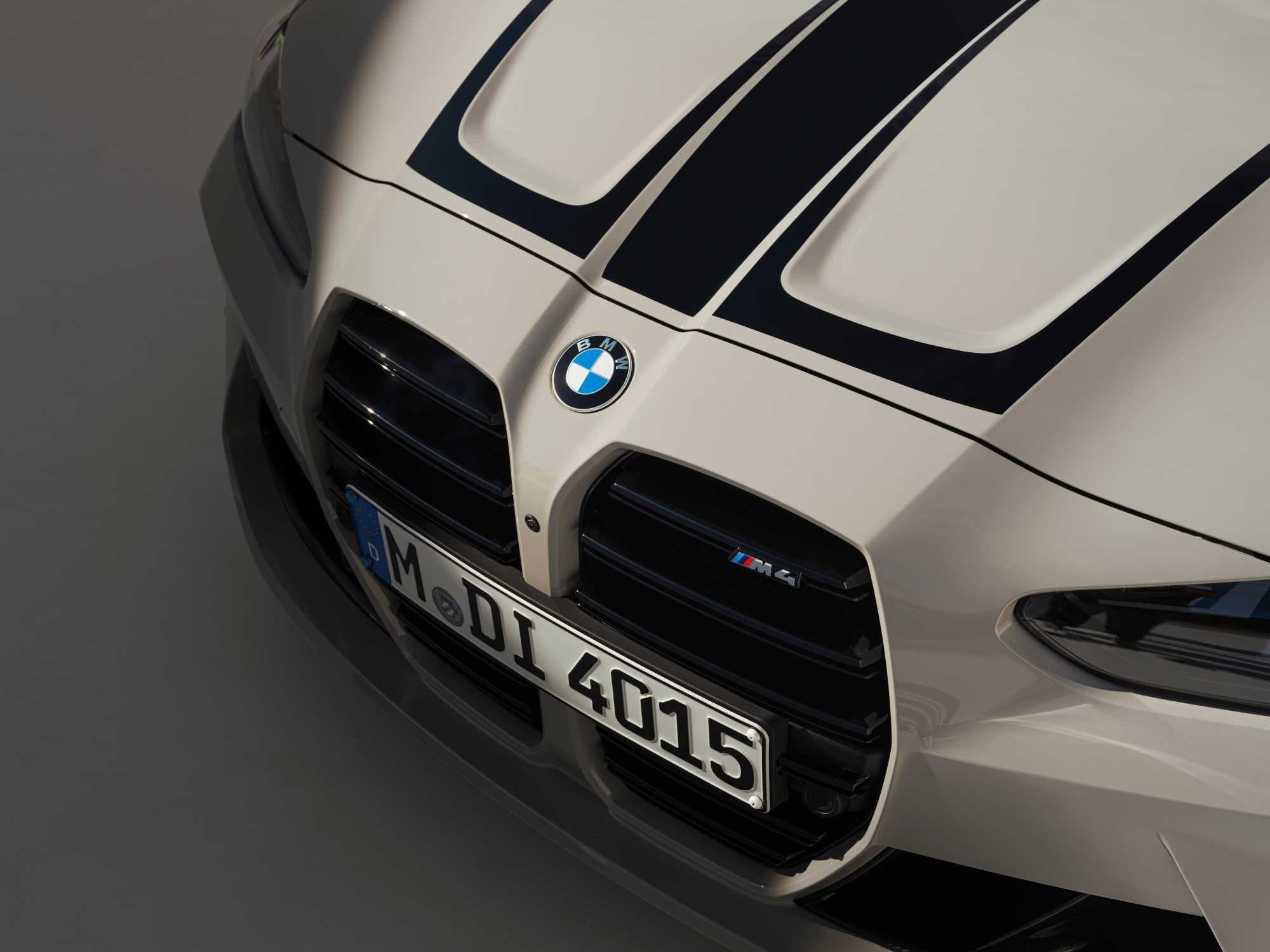 Official BMW photo of M4 Coupe kidney grille with M4 badge and hood graphic