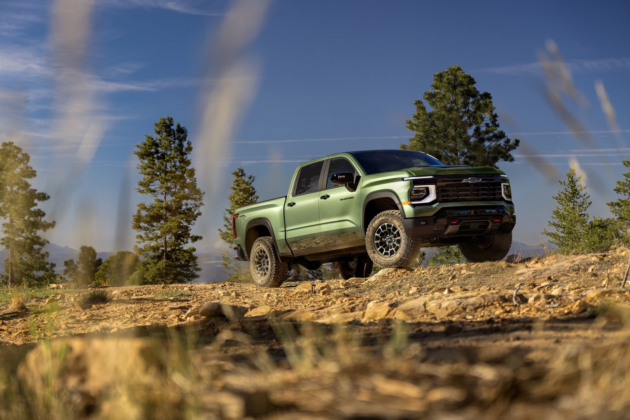 Official Chevrolet photo of the 2027 Silverado 1500 Trail Boss, front three-quarter on a dirt incline