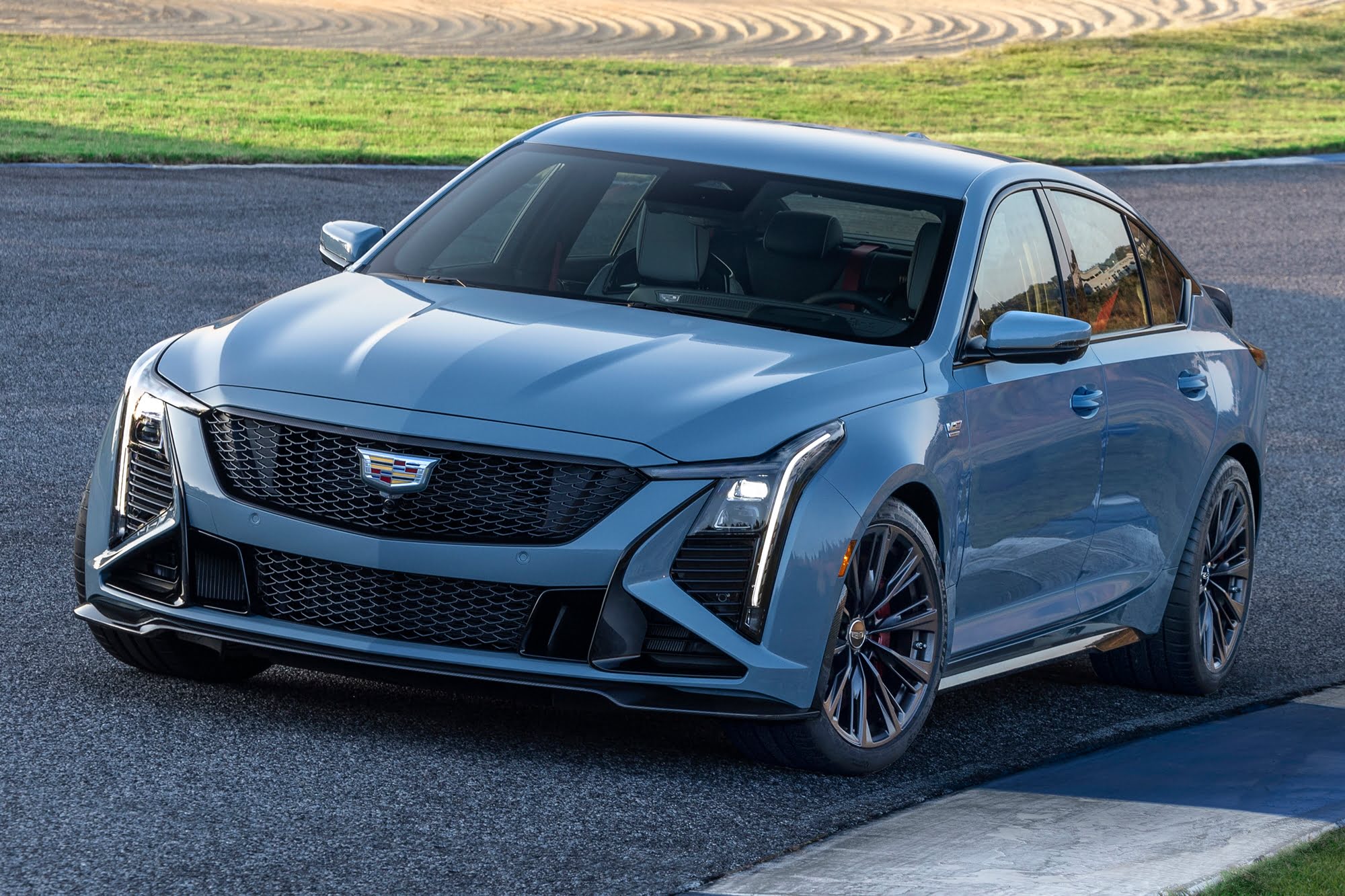 Official Cadillac photo of a CT5-V Blackwing front three-quarter close-up on a racetrack