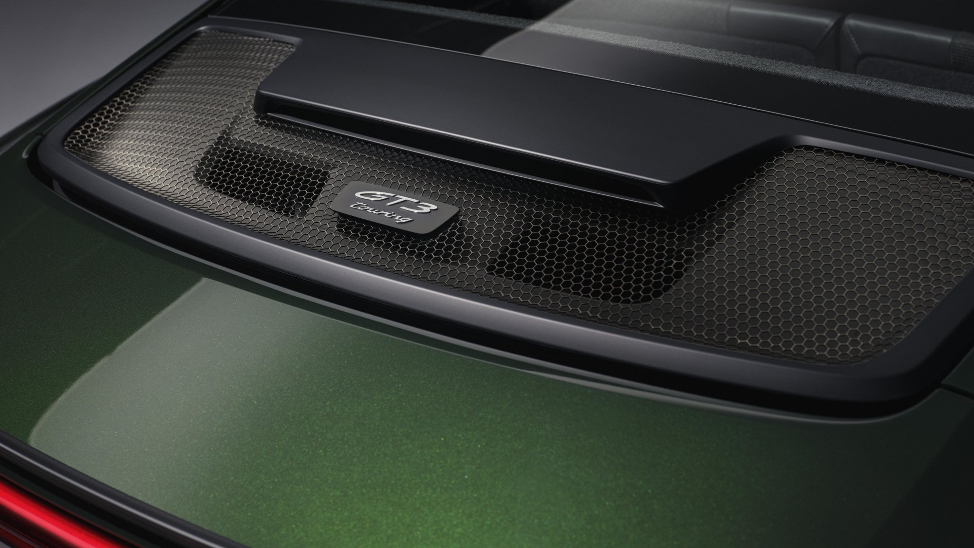 Official Porsche photo of the GT3 Touring badge on the rear decklid grille