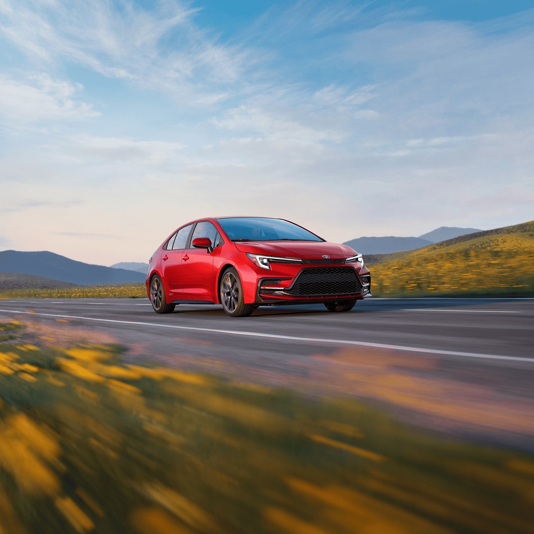 Official Toyota photo of 2027 Corolla sedan front three-quarter in motion