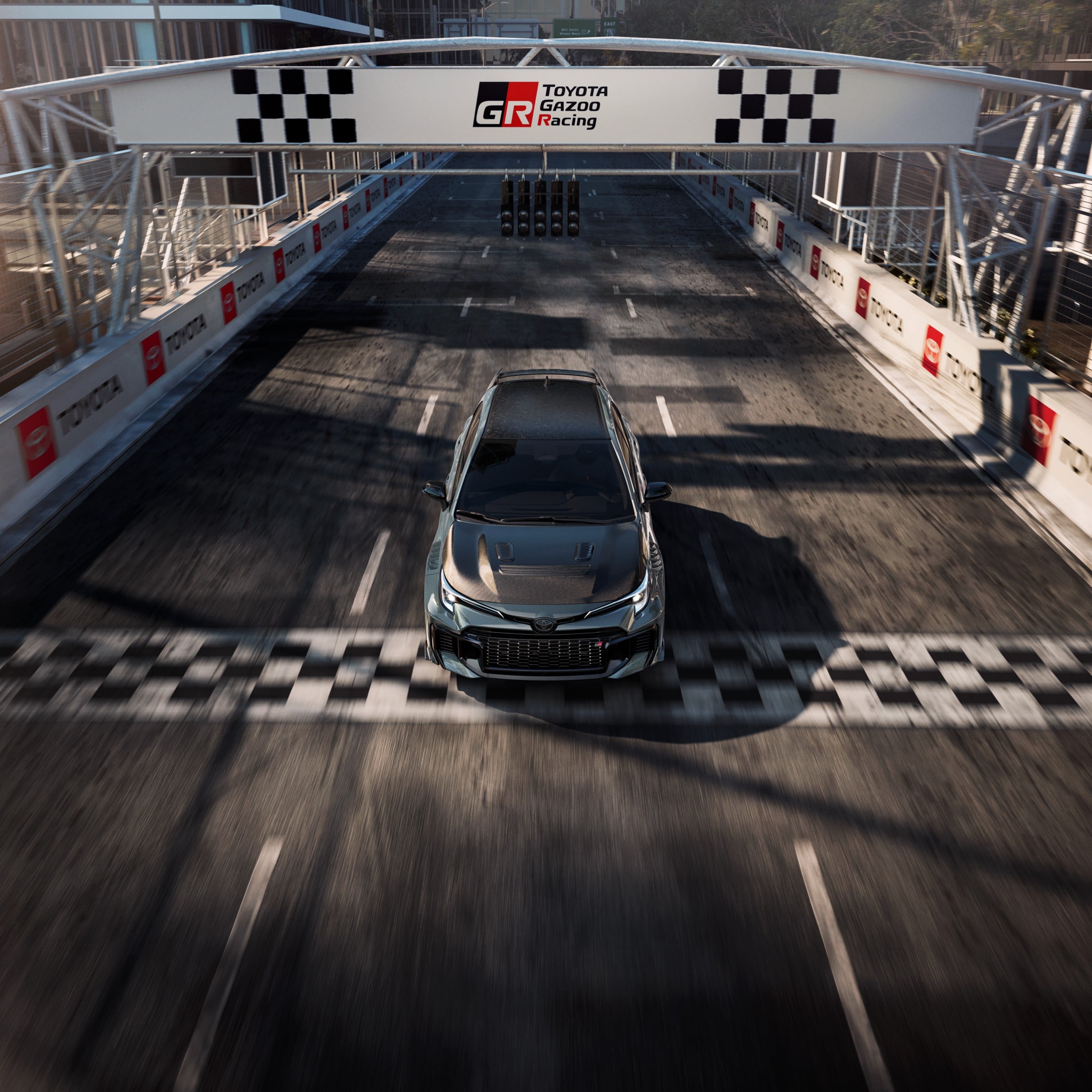 Official Toyota photo of 2026 GRMN Corolla overhead at the start-finish gantry