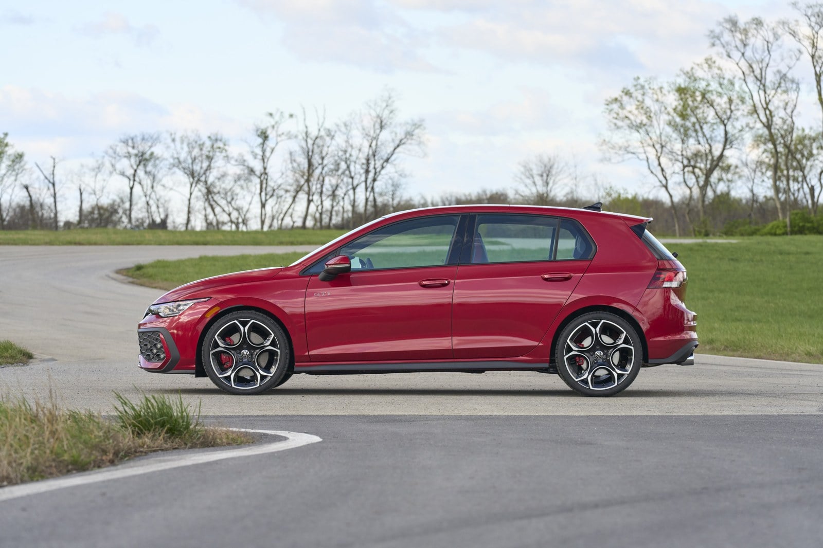 Official VW photo of 2025/2026 Golf GTI Autobahn side profile in Kings Red Metallic