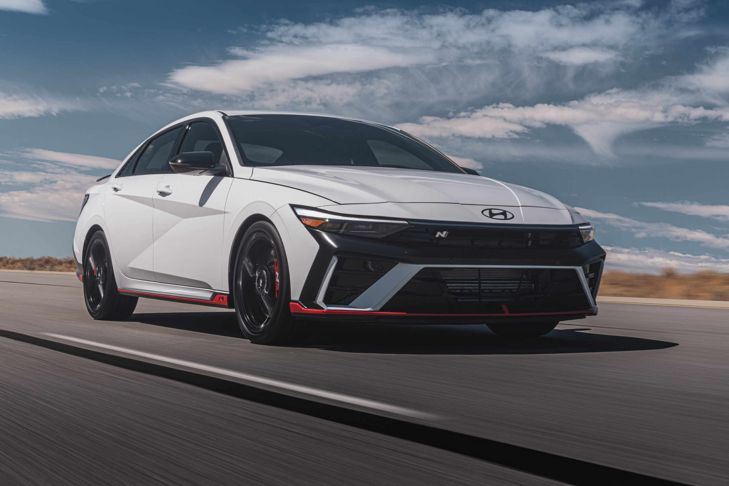 Official Hyundai photo of Elantra N white front three-quarter on desert road