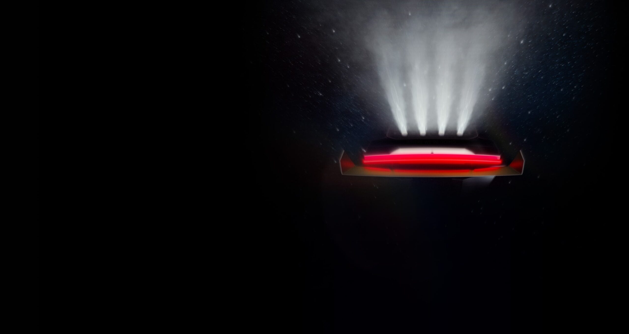 Tesla Roadster countdown page: Roadster wordmark, timer, rear silhouette with four upward plumes