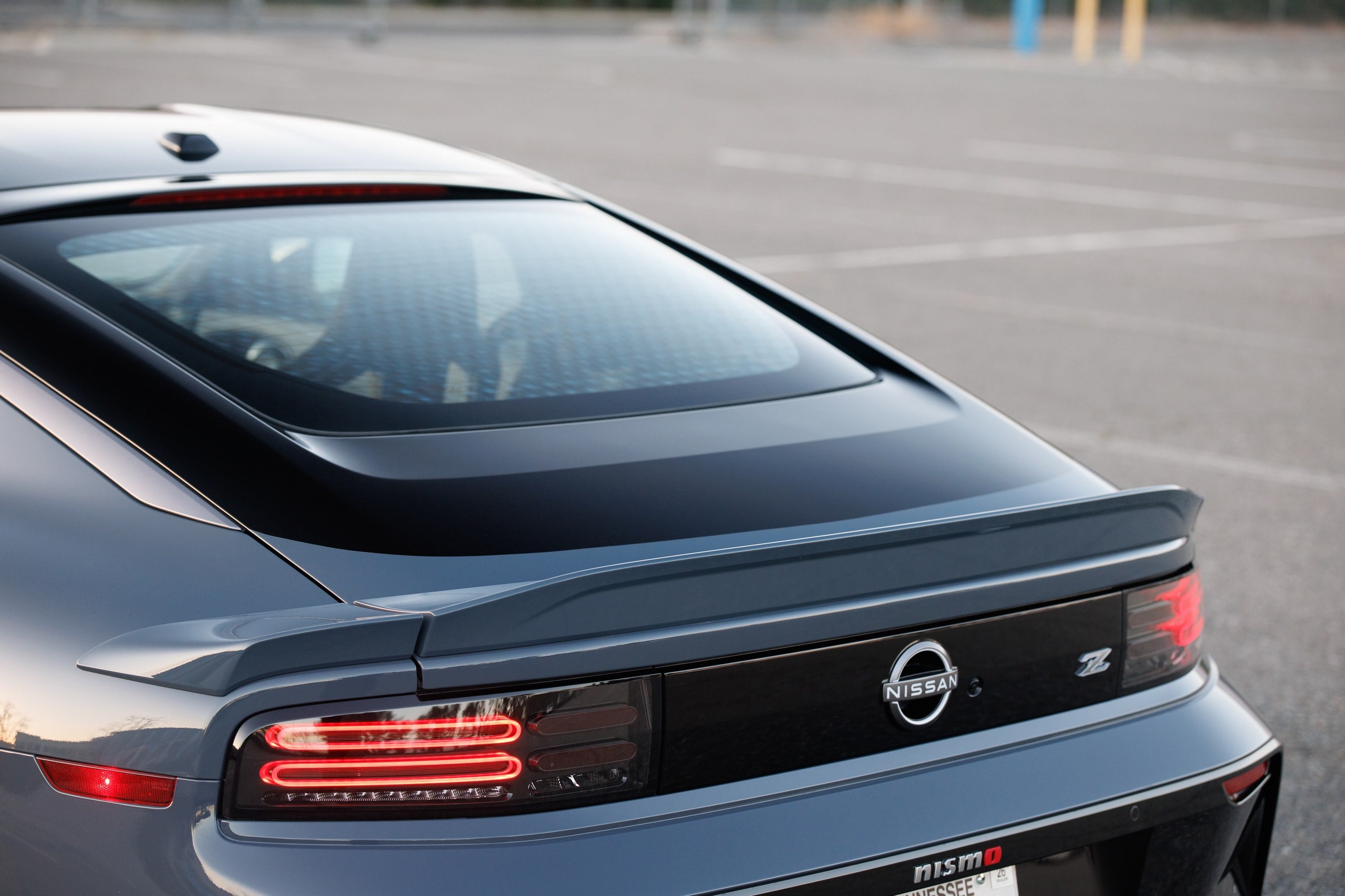 Official Nissan photo of a 2027 Z NISMO rear three-quarter with nismo badge