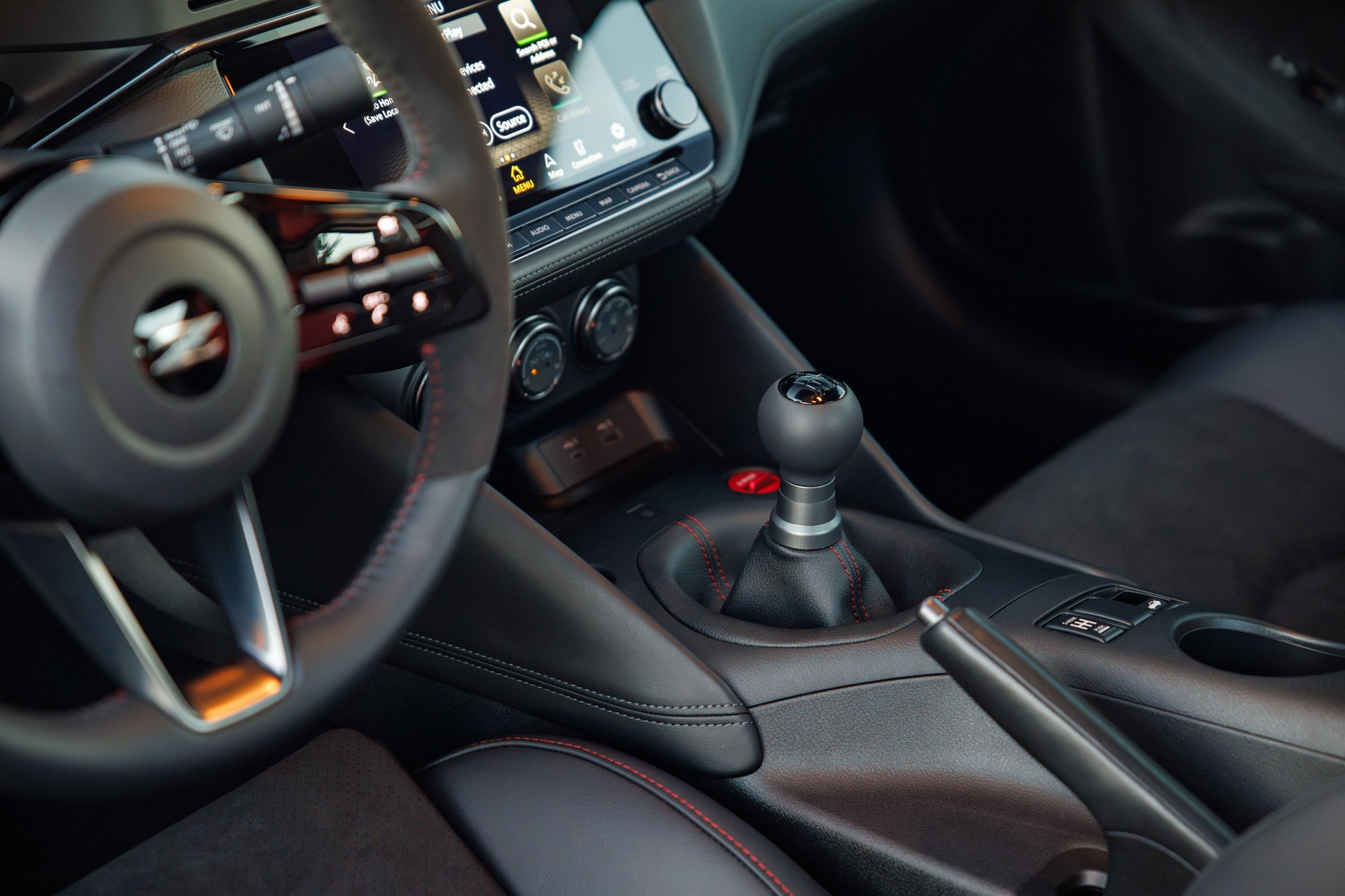 Official Nissan photo of the 2027 Z NISMO cabin with six-speed manual and Z-logo steering wheel